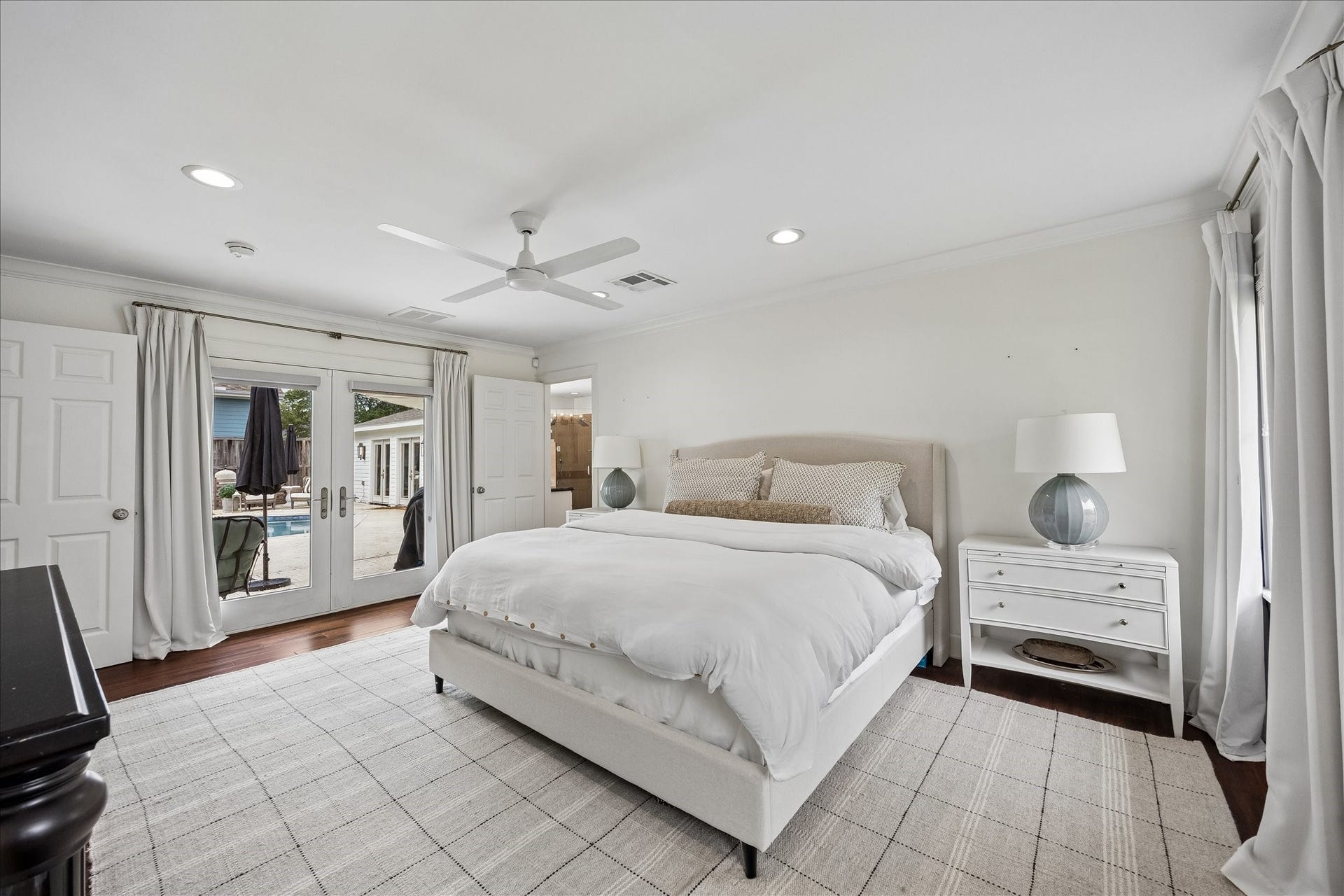 3702 Linkwood Drive, Houston, TX 77025 Primary bedroom with French doors leading to the pool and outdoor oasis.