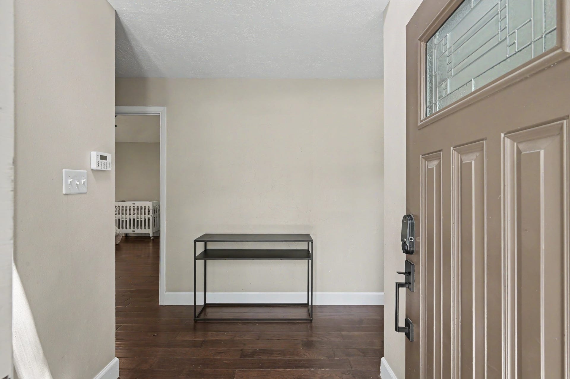 2314 Chestnut Oak Place, The Woodlands, TX 77380 The welcoming entry introduces the homes neutral finishes and engineered wood flooring, which continues throughout the first floor.