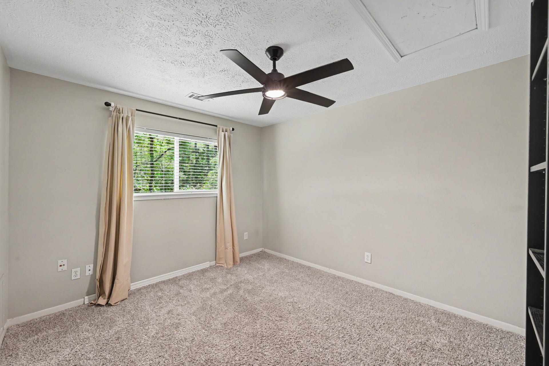 2314 Chestnut Oak Place, The Woodlands, TX 77380 Generously sized Bedroom #2 features a new ceiling fan and overlooks the greenbelt.