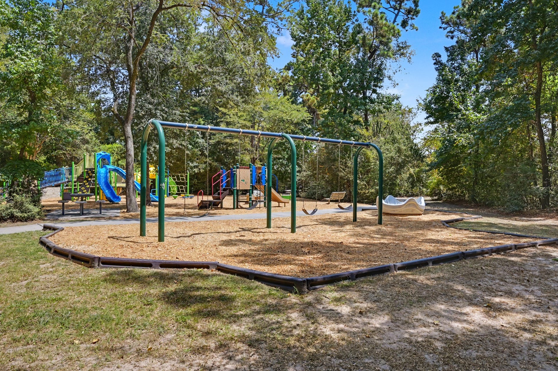 2314 Chestnut Oak Place, The Woodlands, TX 77380 Just a short walk from the home, Sawmill Park offers a spacious and well shaded playground.