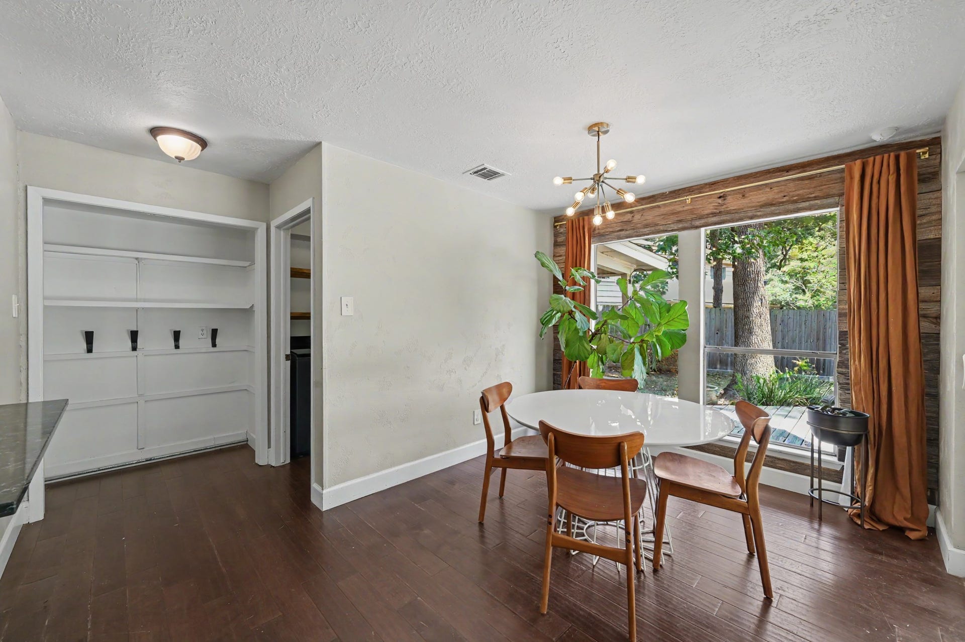 2314 Chestnut Oak Place, The Woodlands, TX 77380 The breakfast room includes convenient built-in shelving and hooks that create a practical drop zone near the kitchen.