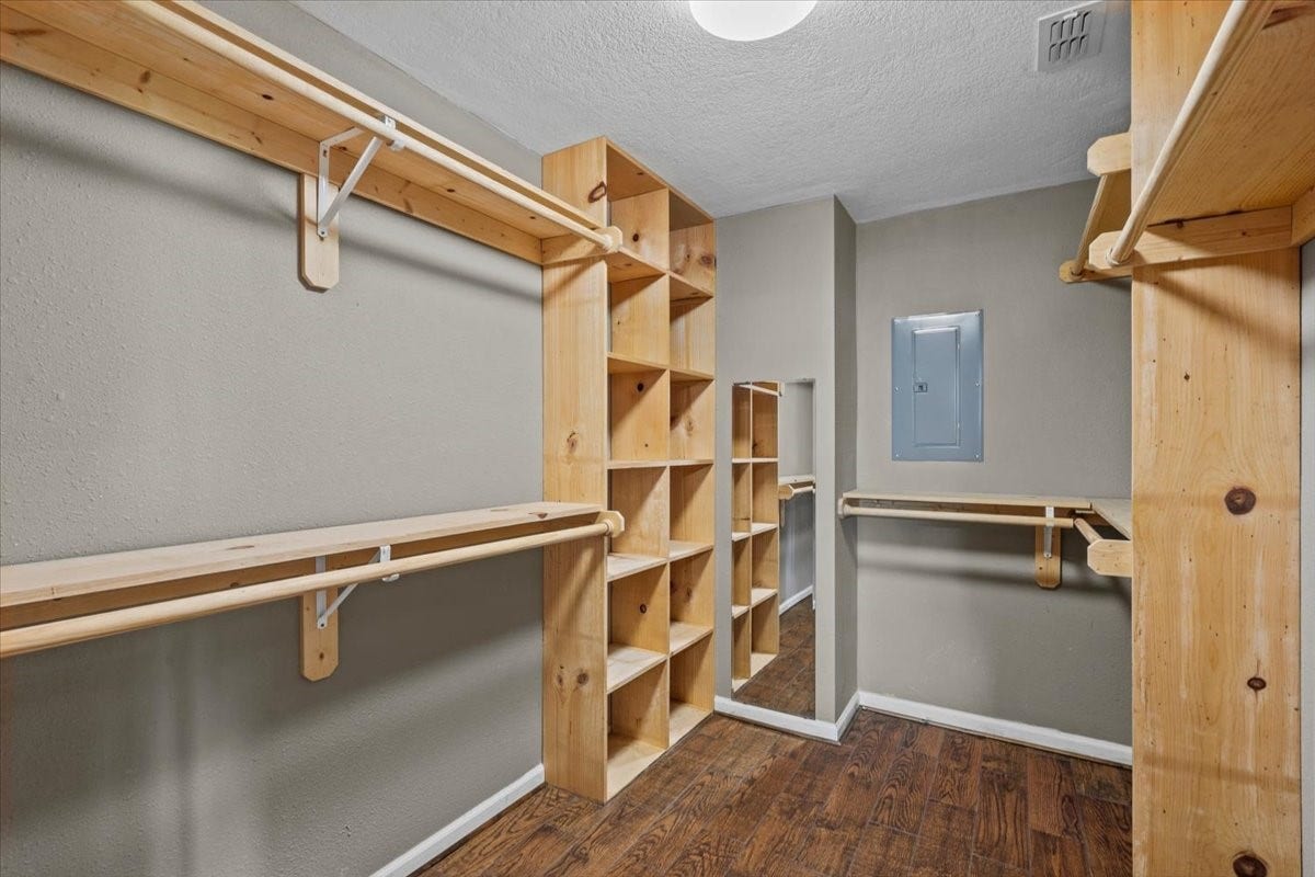 7228 Avenue R, Santa Fe, TX 77510 Primary walk-in closet with built in shelving.