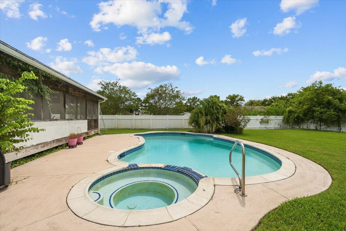 7228 Avenue R, Santa Fe, TX 77510 Pool and hot tub area. Pool has a deep end and diving board has been removed for insurance purposes.
