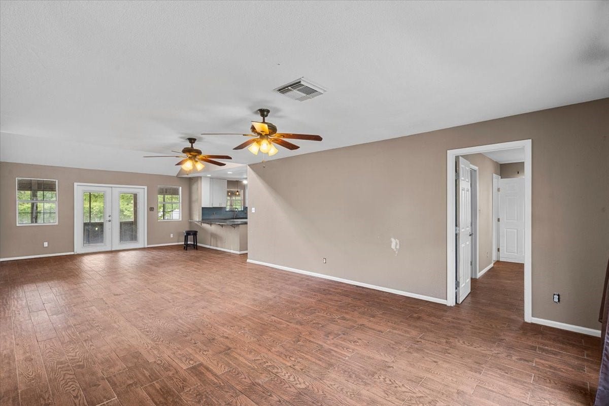 7228 Avenue R, Santa Fe, TX 77510 Dining room area with french doors to the screened porch.