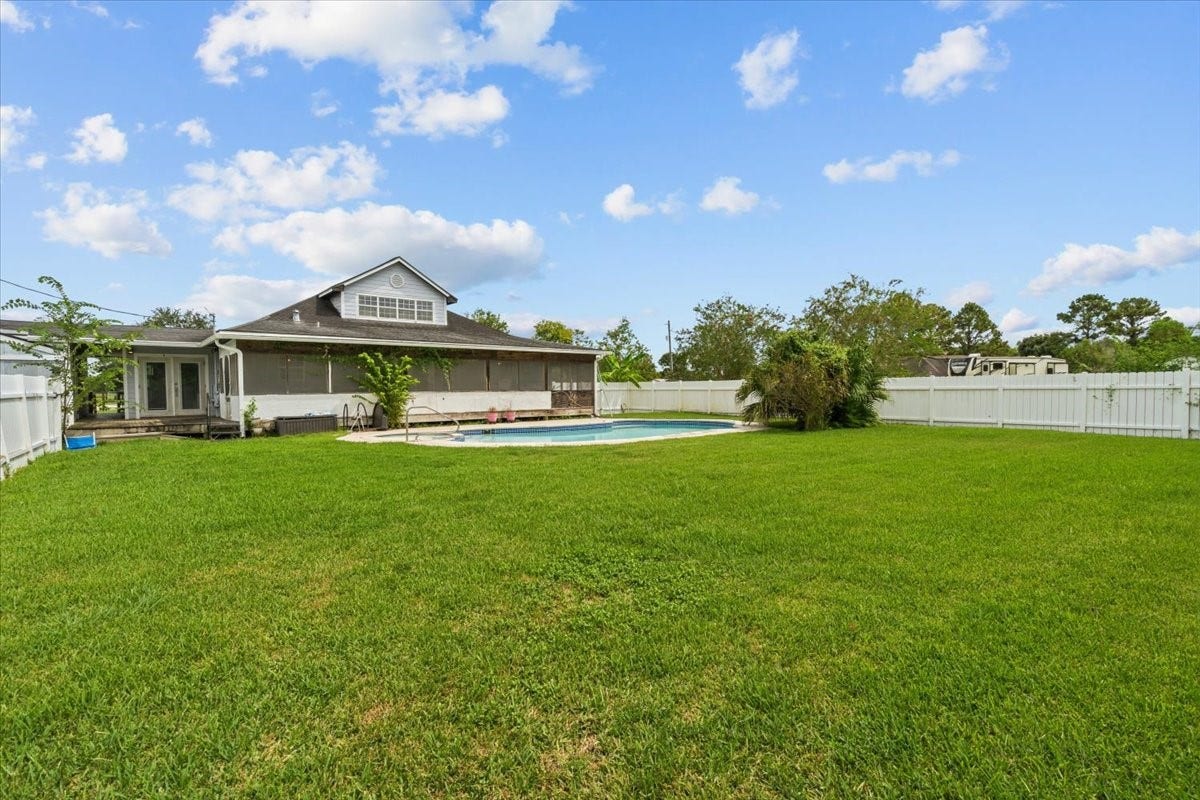 7228 Avenue R, Santa Fe, TX 77510 Back yard has lots of room for entertaining. Diving board on pool has been removed for insurance purposes. Pool has a deep end.