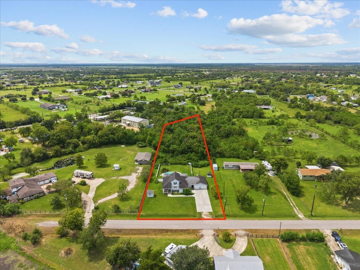 7228 Avenue R, Santa Fe, TX 77510 1.7 acres extends beyond the white fenced back yard area.