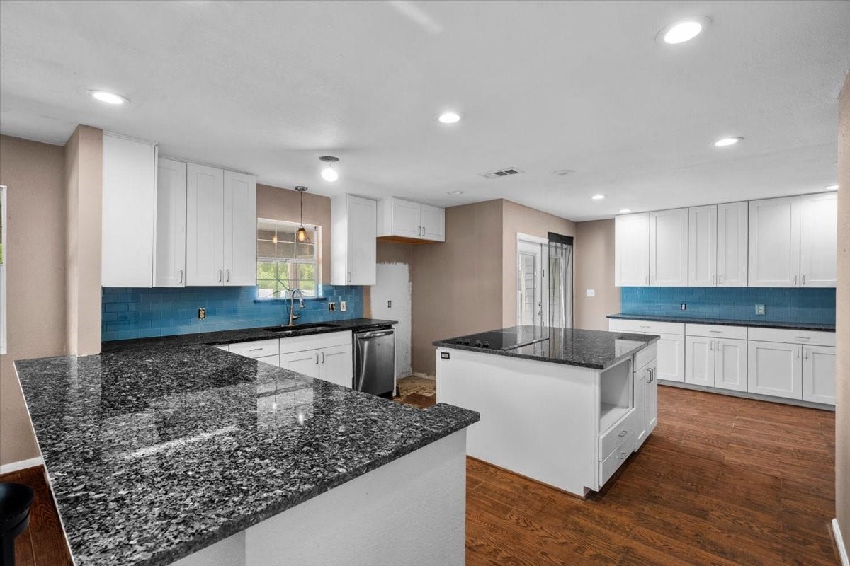 7228 Avenue R, Santa Fe, TX 77510 Large kitchen with plenty of counters and storage.