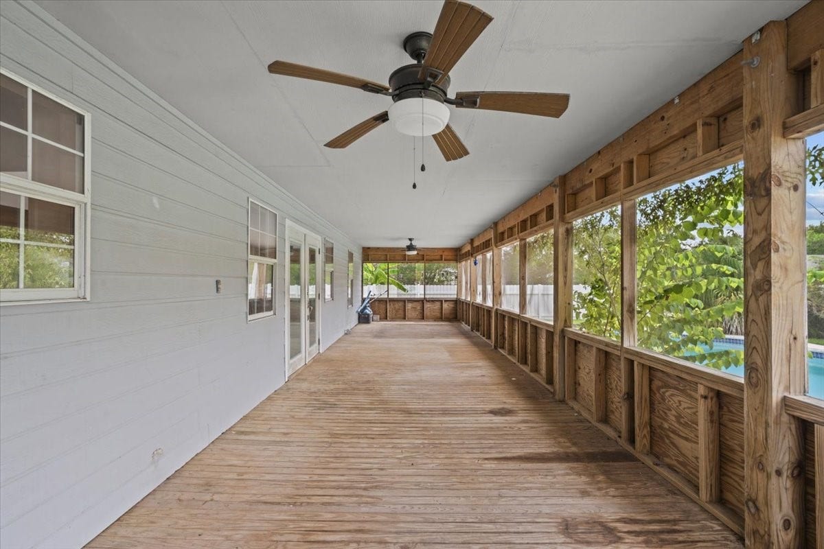 7228 Avenue R, Santa Fe, TX 77510 Screened in porch runs the length of the house.