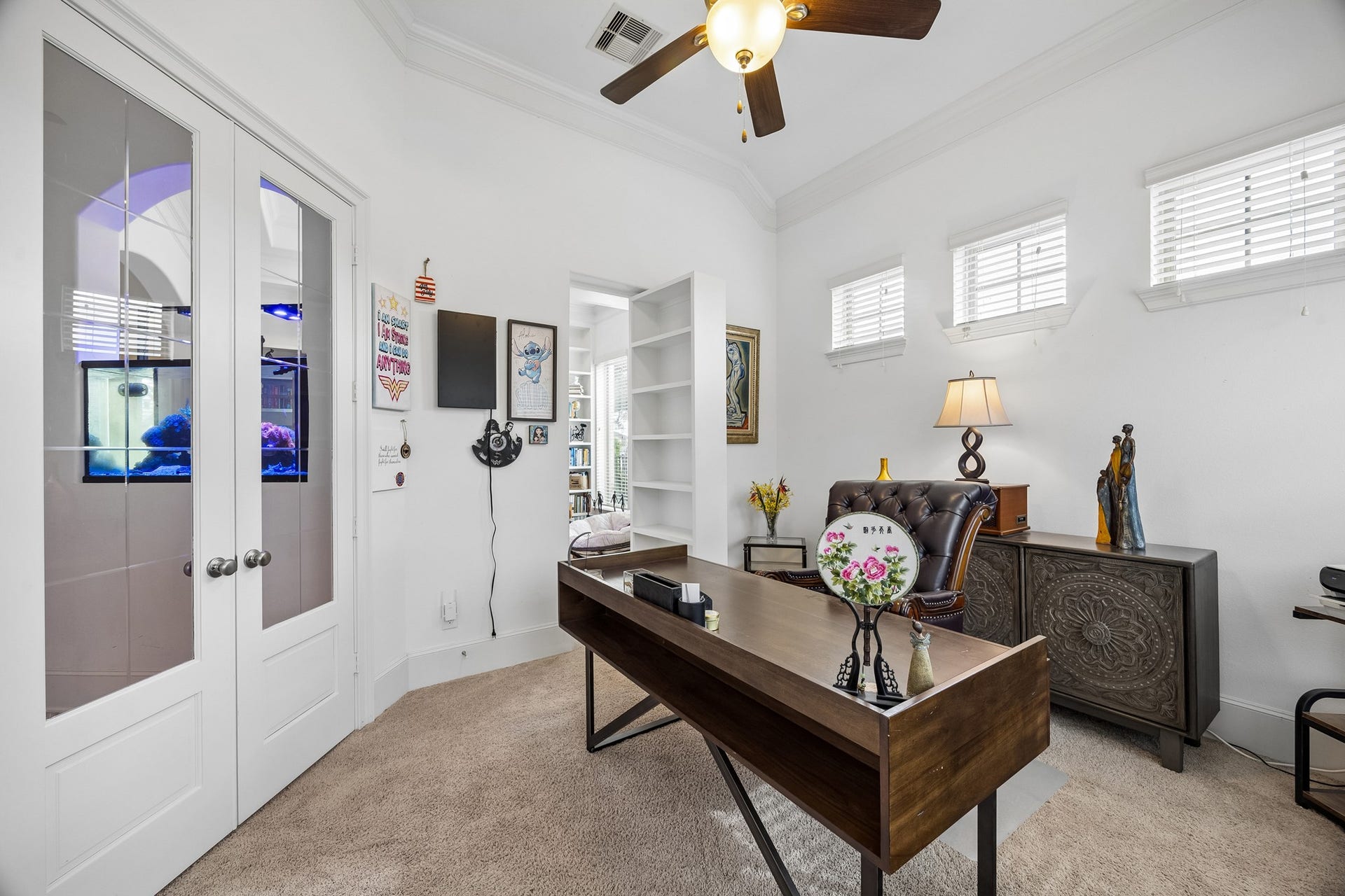 5018 Southampton Road, Missouri City, TX 77459 This home office with French doors and abundant natural light also has a hideaway door offering versatility and a serene workspace.
