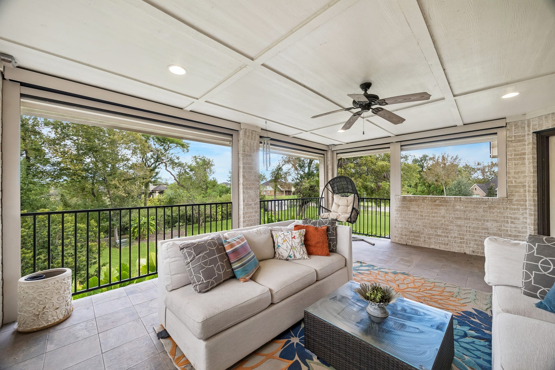 5018 Southampton Road, Missouri City, TX 77459 Spacious 2nd floor covered outdoor living area with remote controlled shades provides serene views of the backyard oasis. It is the perfect place for relaxation and entertaining.