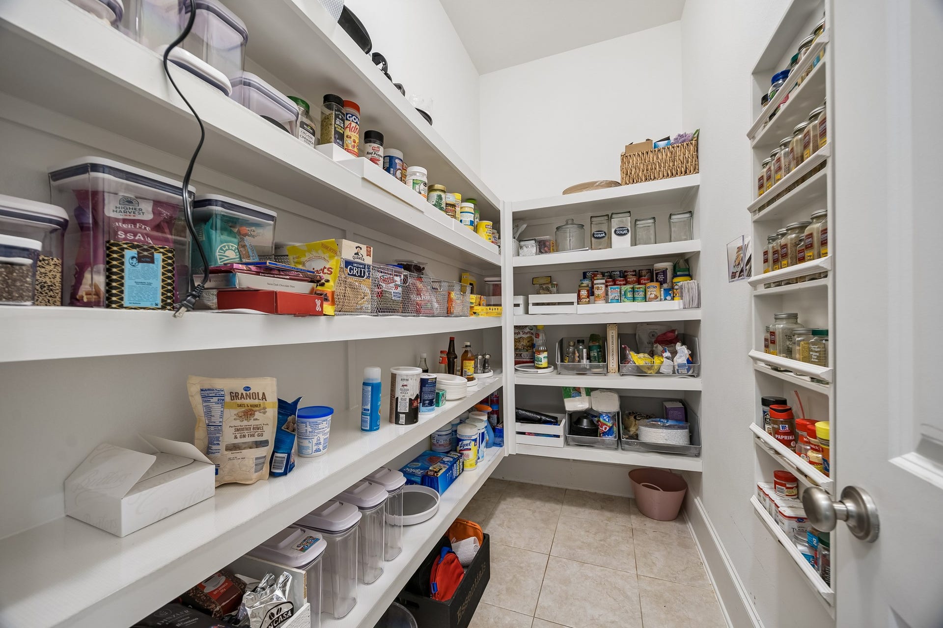 5018 Southampton Road, Missouri City, TX 77459 Spacious walk-in pantry with ample shelving for organized storage of groceries and kitchen essentials.