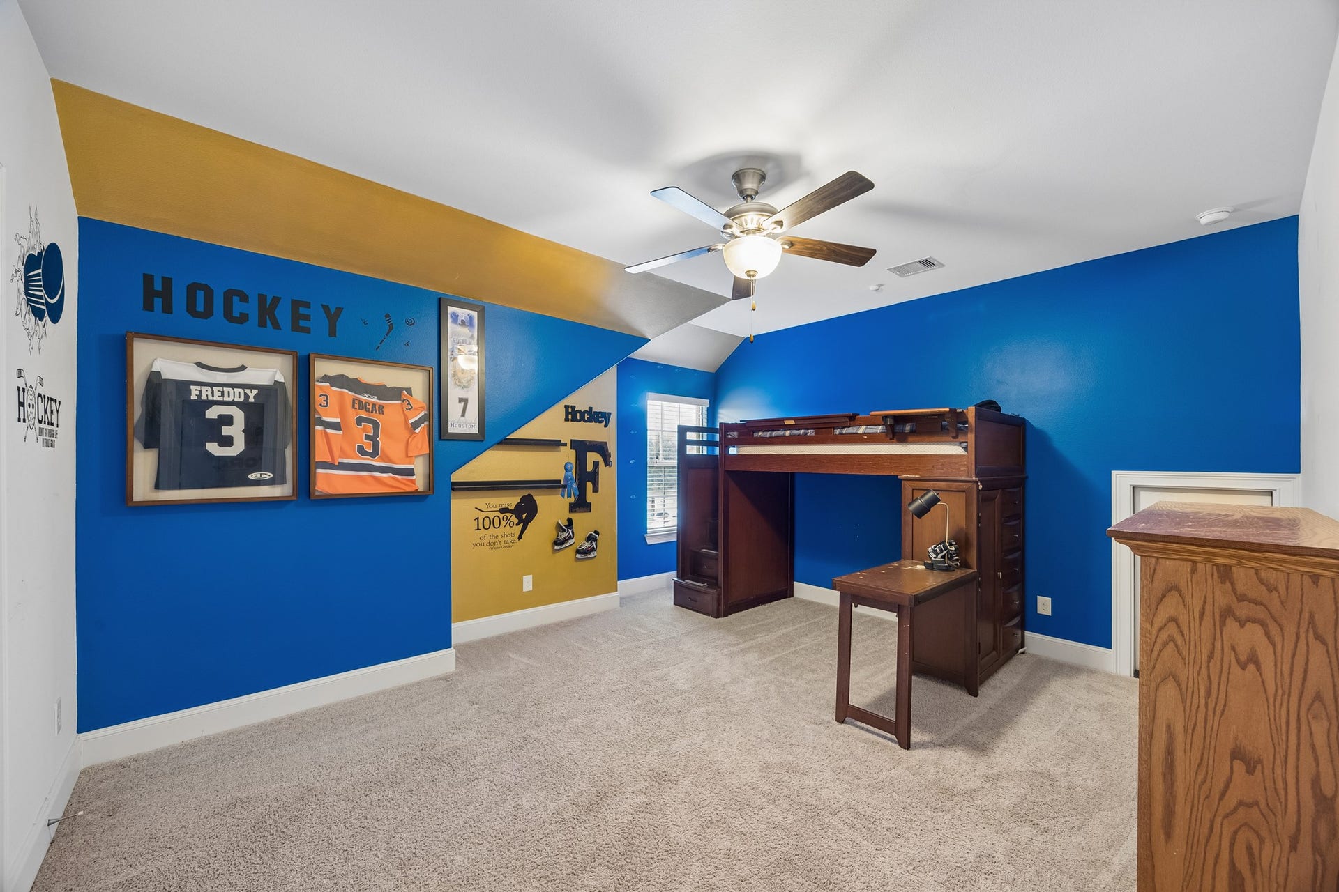 5018 Southampton Road, Missouri City, TX 77459 Bright and spacious sports-themed bedroom featuring a ceiling fan and additional storage space in addition to the closet.