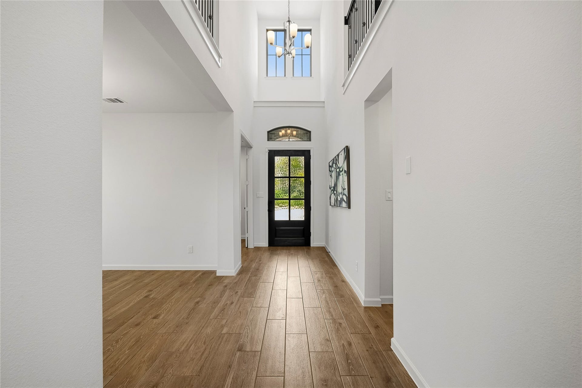 10606 Novy Grove Drive, Missouri City, TX 77459 The two-story entry is very dramatic, with the focal point being the mahogany front door with 6 Flemish glass panels and transom windows above. The windows and light color palette really keep things light and bright!