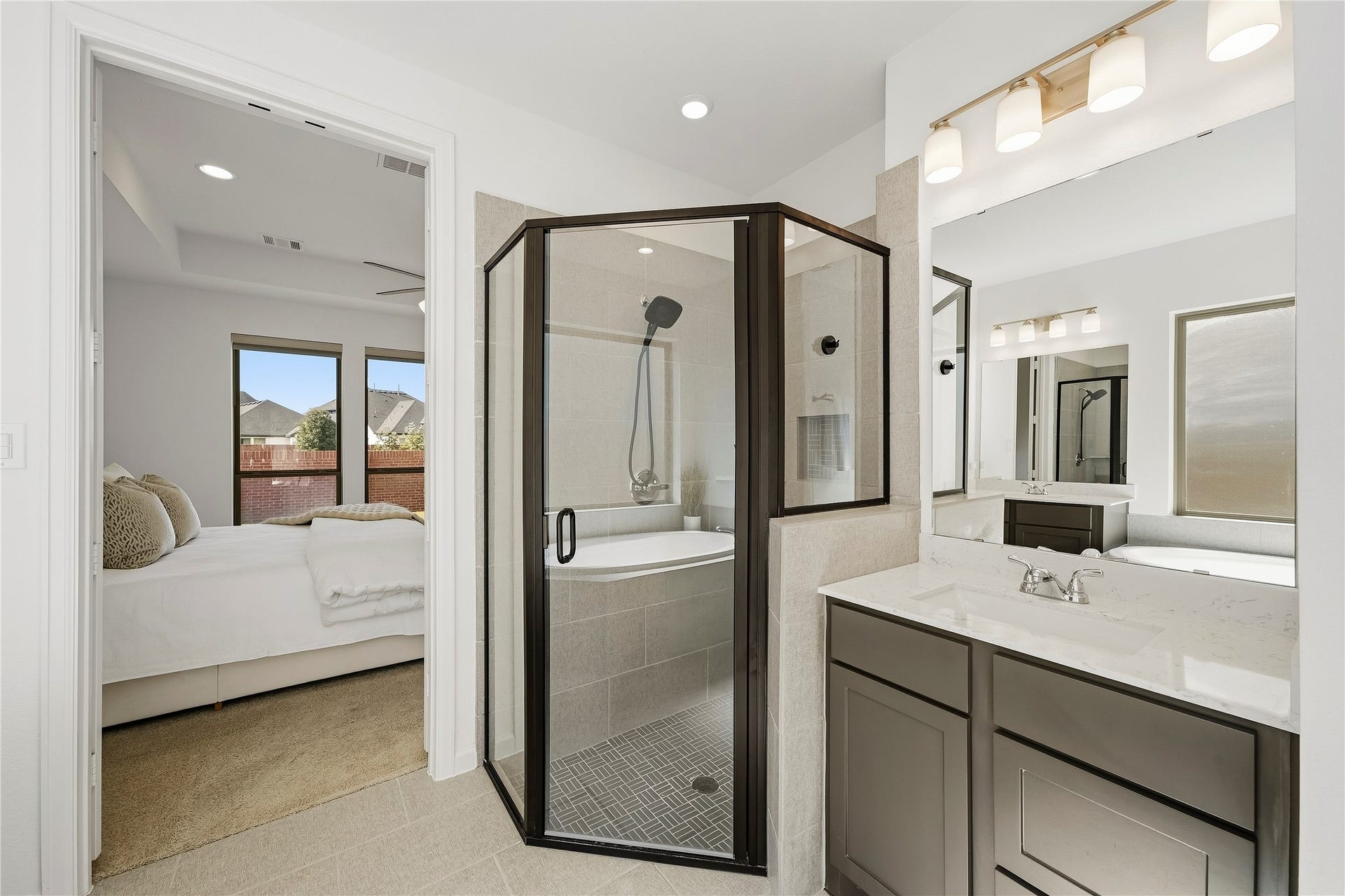 10606 Novy Grove Drive, Missouri City, TX 77459 The oversized corner shower has a whimsical decorative tile floor.