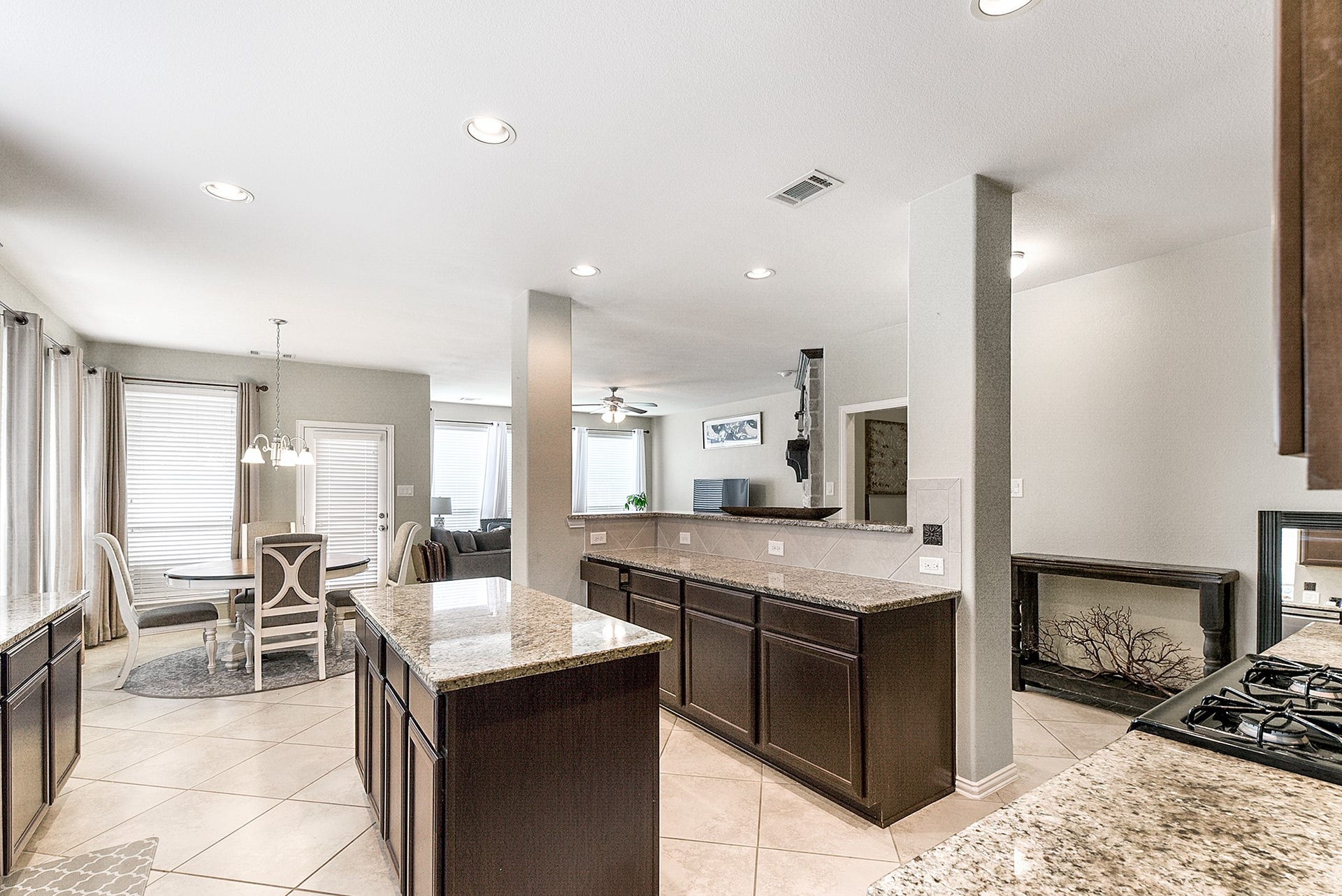 The double island kitchen is truly remarkable, providing ample space for multiple cooks to work simultaneously. The two islands offer abundant prep space, while also serving as convenient breakfast bar seating areas, perfect for enjoying meals and gatherings with family and friends.
