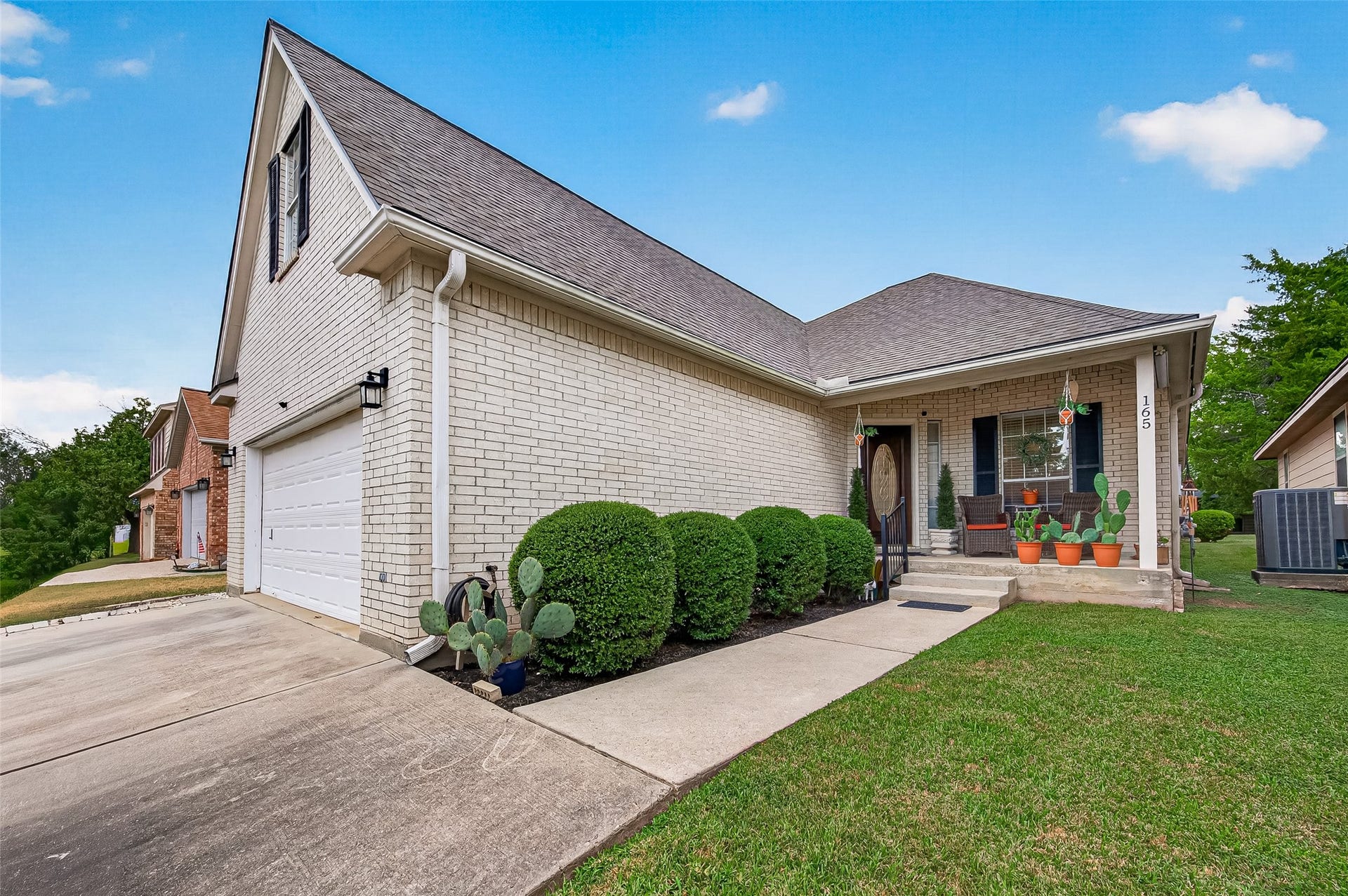 165 April Cove, Montgomery, TX 77356 Brick home with front porch to greet your guests