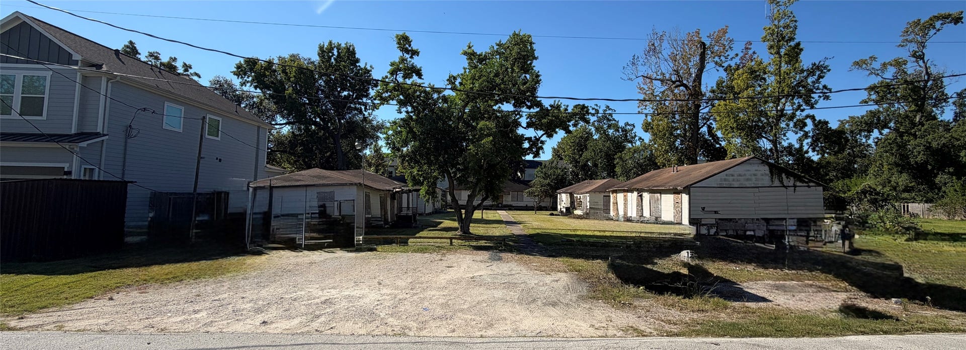 511 Marcella Street, Houston, TX 77091 Expansive lot with mature trees and multiple structures, offering potential for development or renovation.