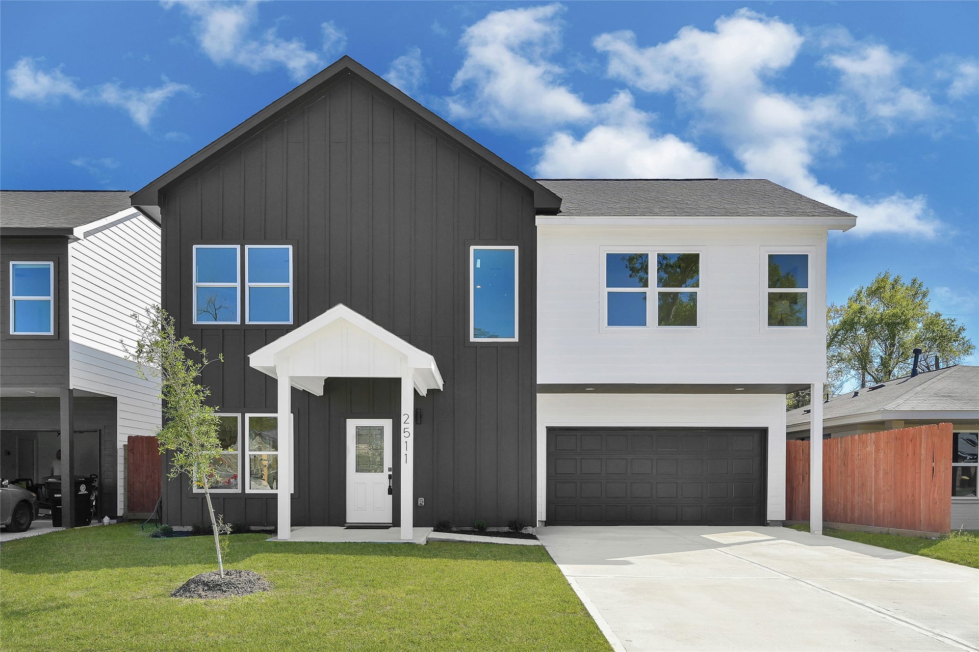 2511 Garapan Street, Houston, TX 77091 Sleek two-story modern facade with clean lines and fresh landscaping.