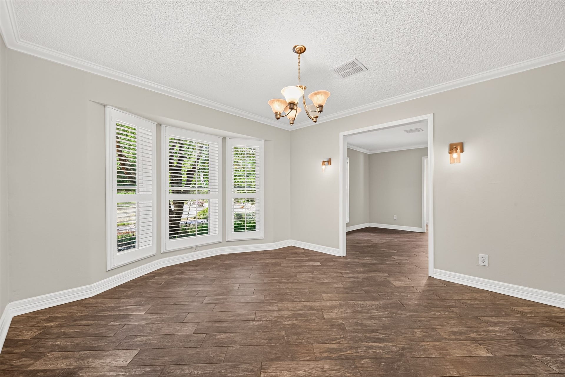 16814 Creeksouth Road, Houston, TX 77068 The formal dinnig room is jeweled with custom crown molding and baseboards, custom window shutters, and decorative wall sconce lighting. This will set the mood for elegant dinners and entertaining.