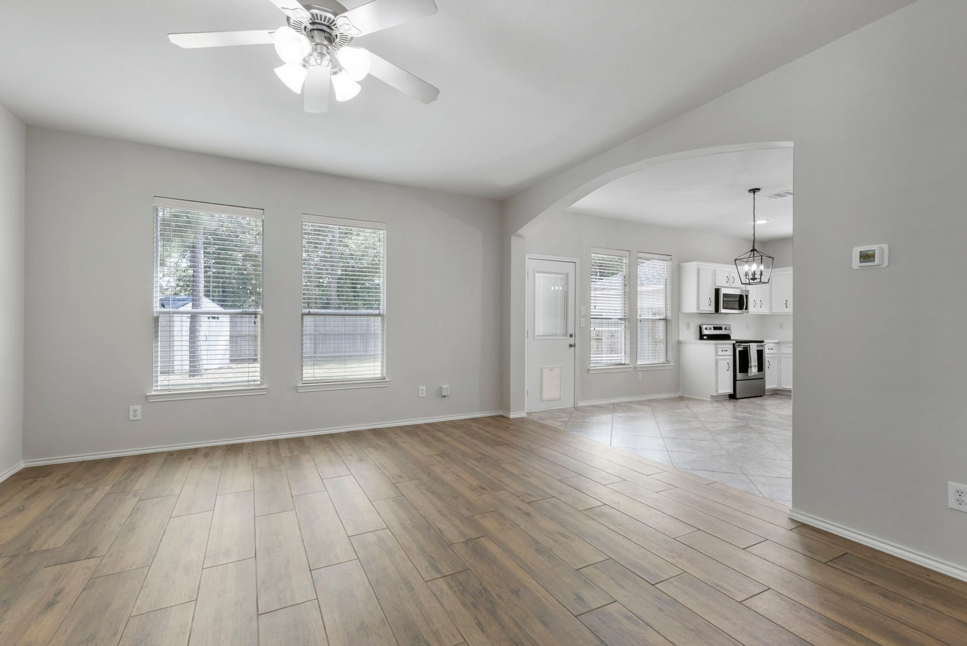 2318 Colonial Springs Lane, Spring, TX 77386 The living room opens to the breakfast room and kitchen.