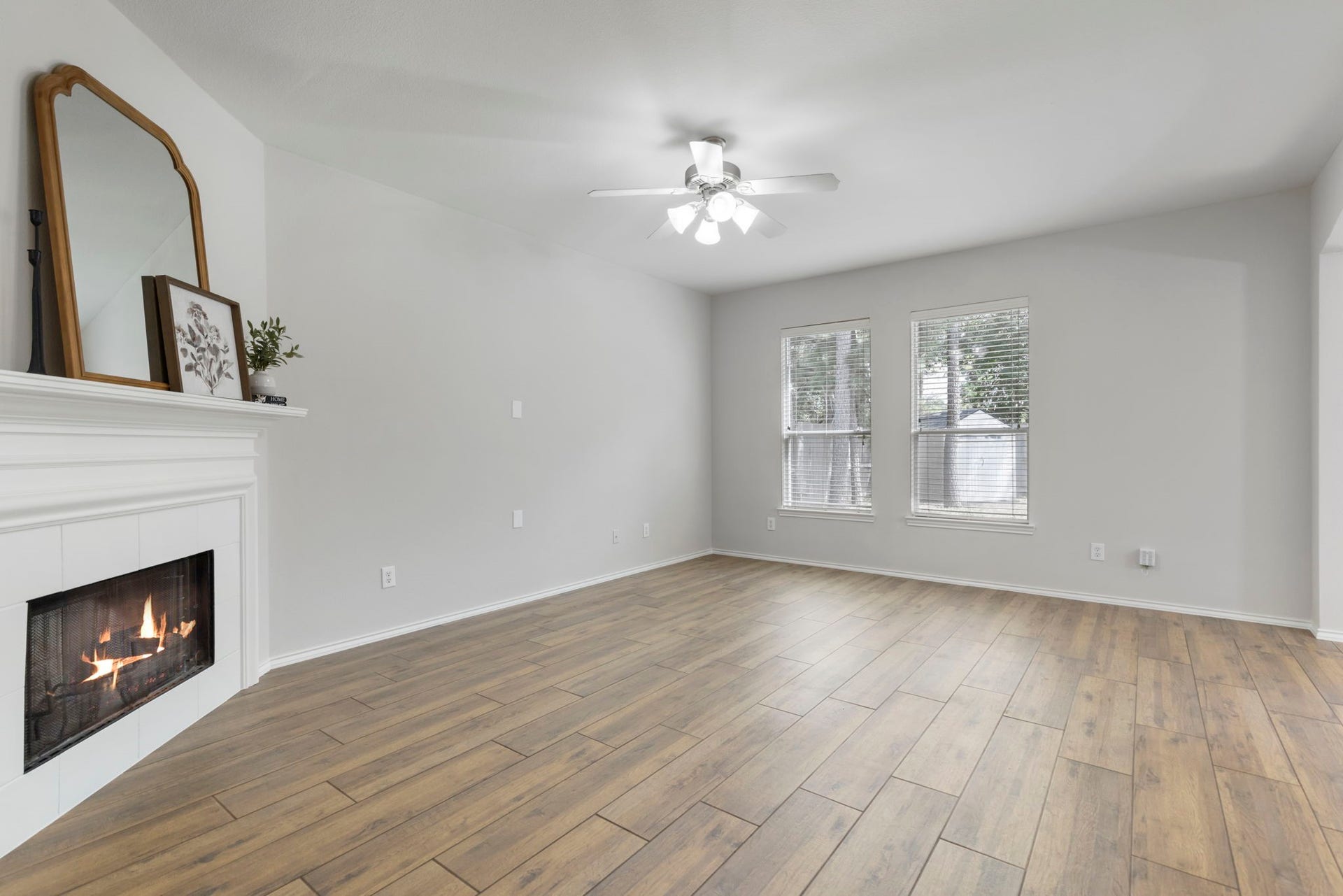 2318 Colonial Springs Lane, Spring, TX 77386 Large living room with charming fireplace and natural light.