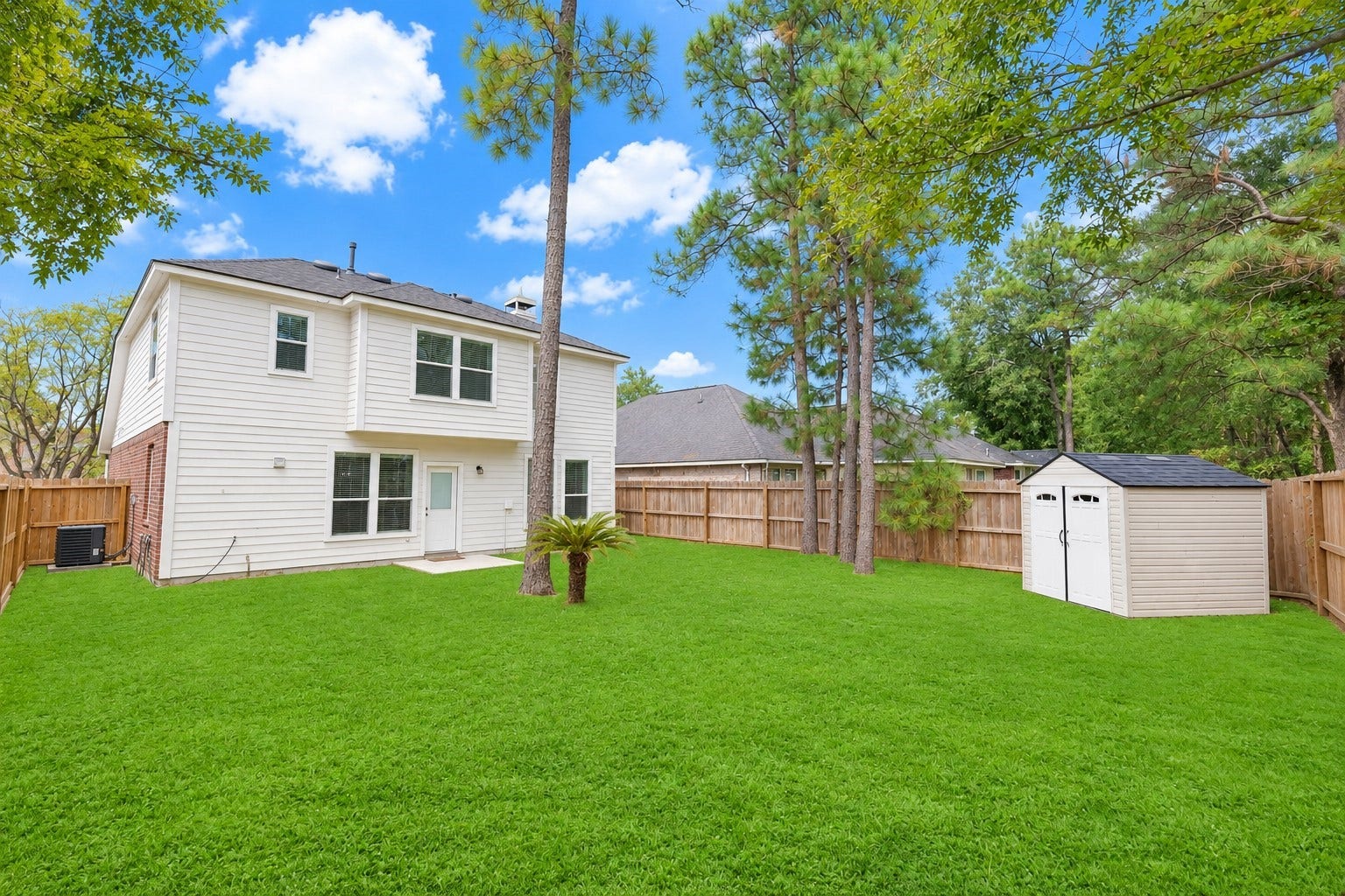 2318 Colonial Springs Lane, Spring, TX 77386 Another view of the yard with shed included. Grass has been enhanced.
