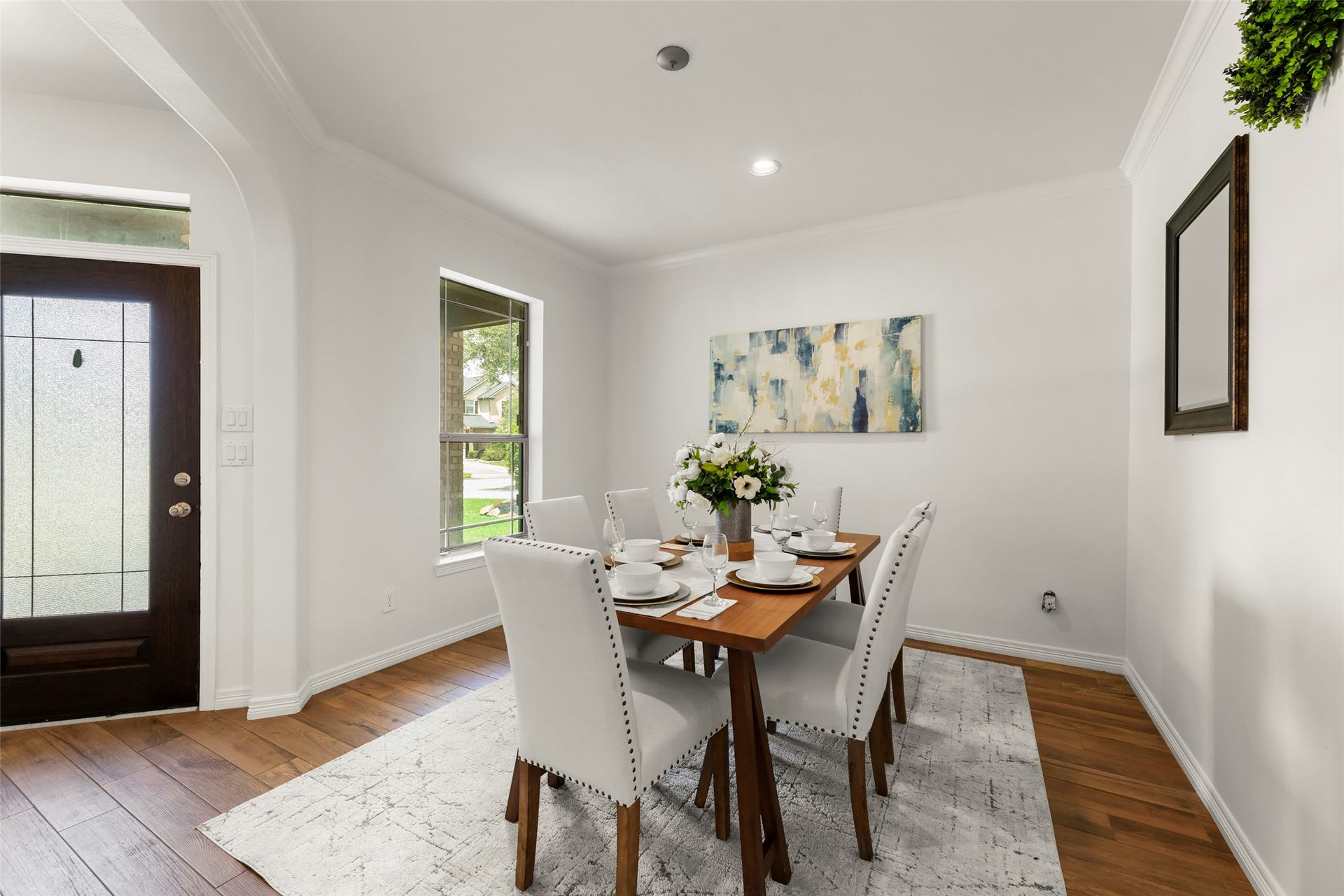 4534 Montcliff Bend Lane, Sugar Land, TX 77479 Bright and inviting dining area with elegant wood flooring and large windows that offer plenty of natural light.