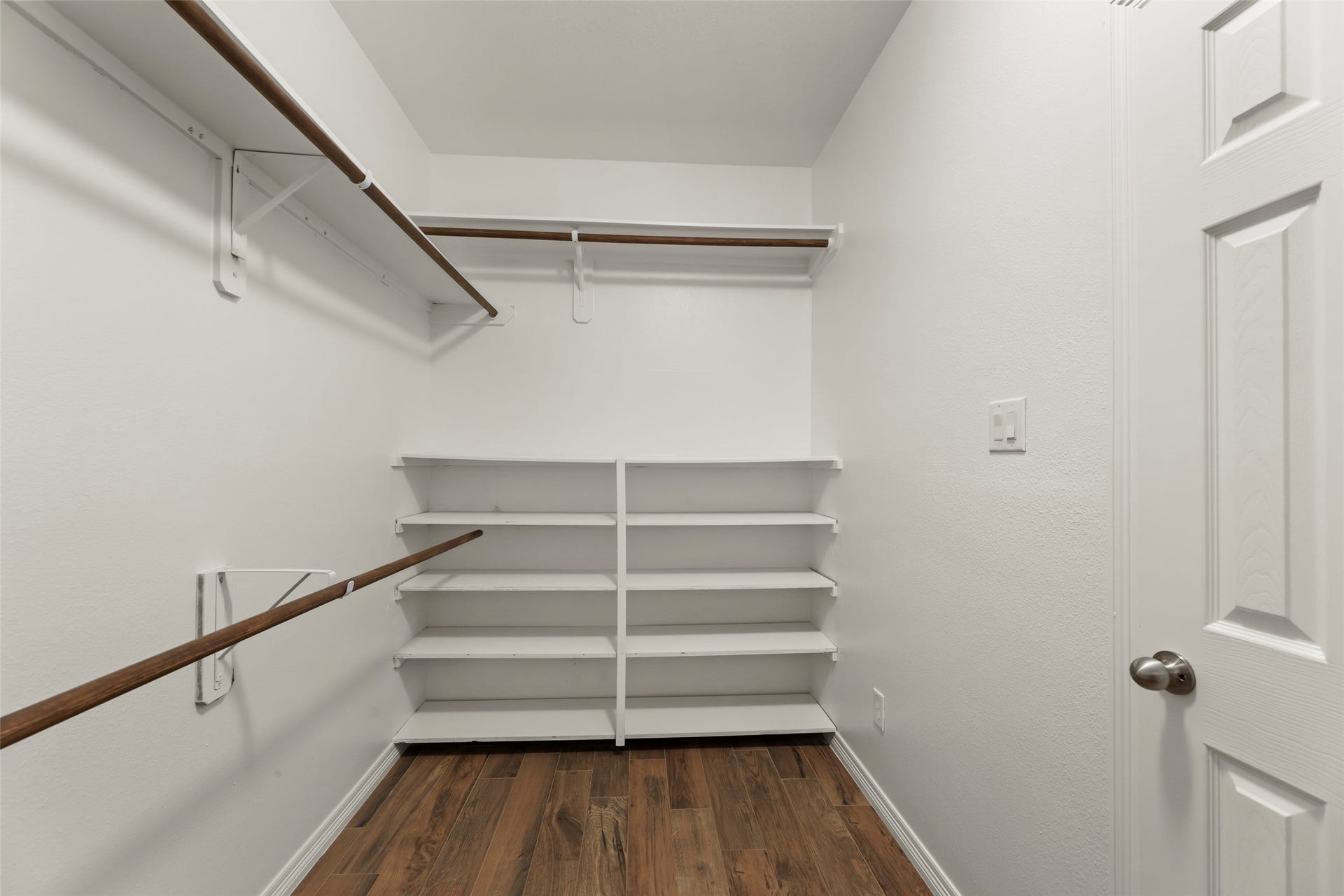4534 Montcliff Bend Lane, Sugar Land, TX 77479 Enormous walk-in closet featuring abundant shelving and hanging space, complemented by beautiful flooring.