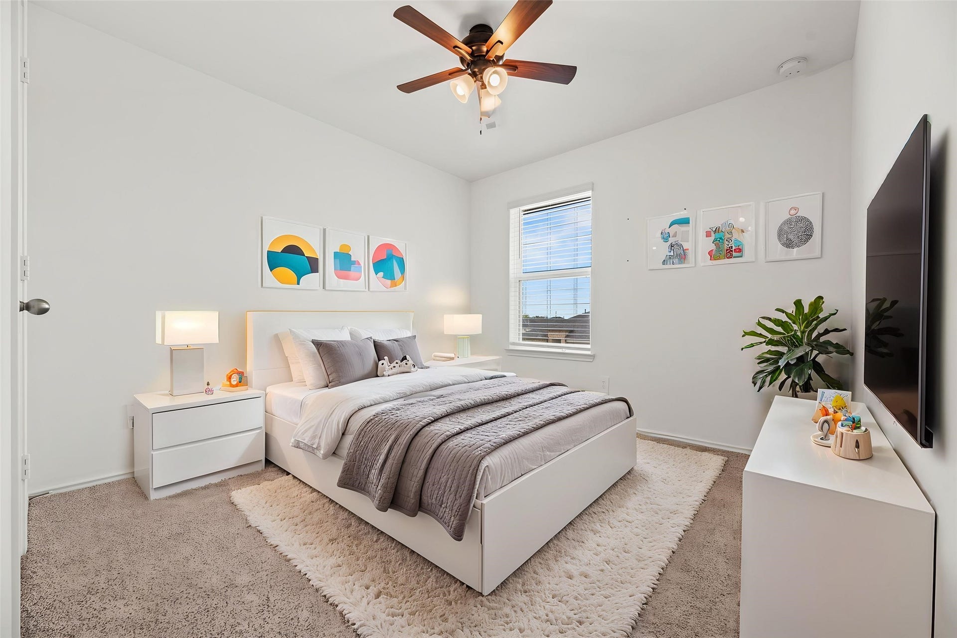 This comfortable secondary bedroom offers a bright and inviting space, featuring a beautiful large window. Virtually staged so you can imagine the possibilities.