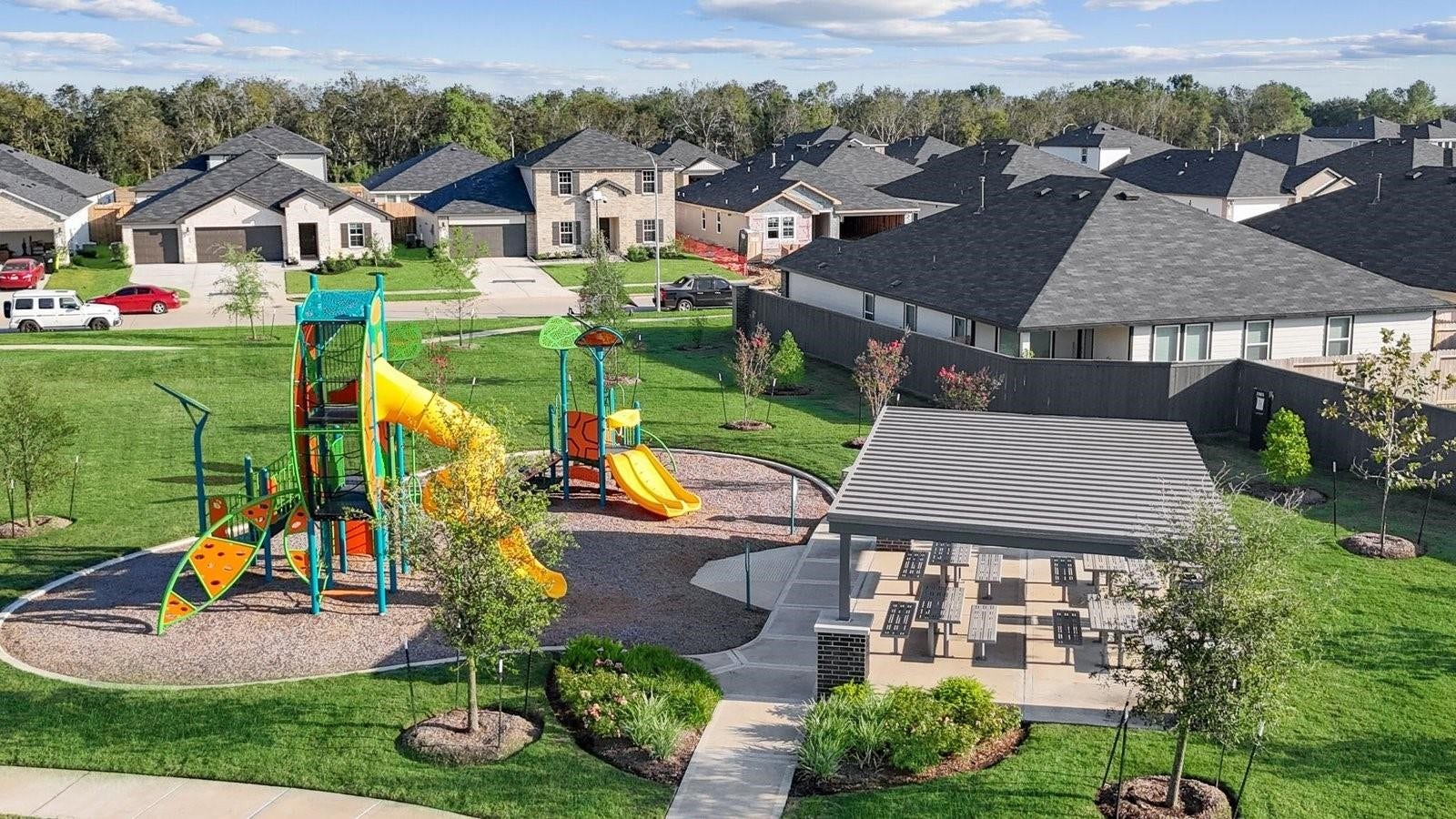 Neighborhood park and playground within Bryan Grove, offering open green space, a modern play structure, and shaded picnic seatingcreating a convenient gathering spot for outdoor play, weekend relaxation, and enjoying community life close to home.