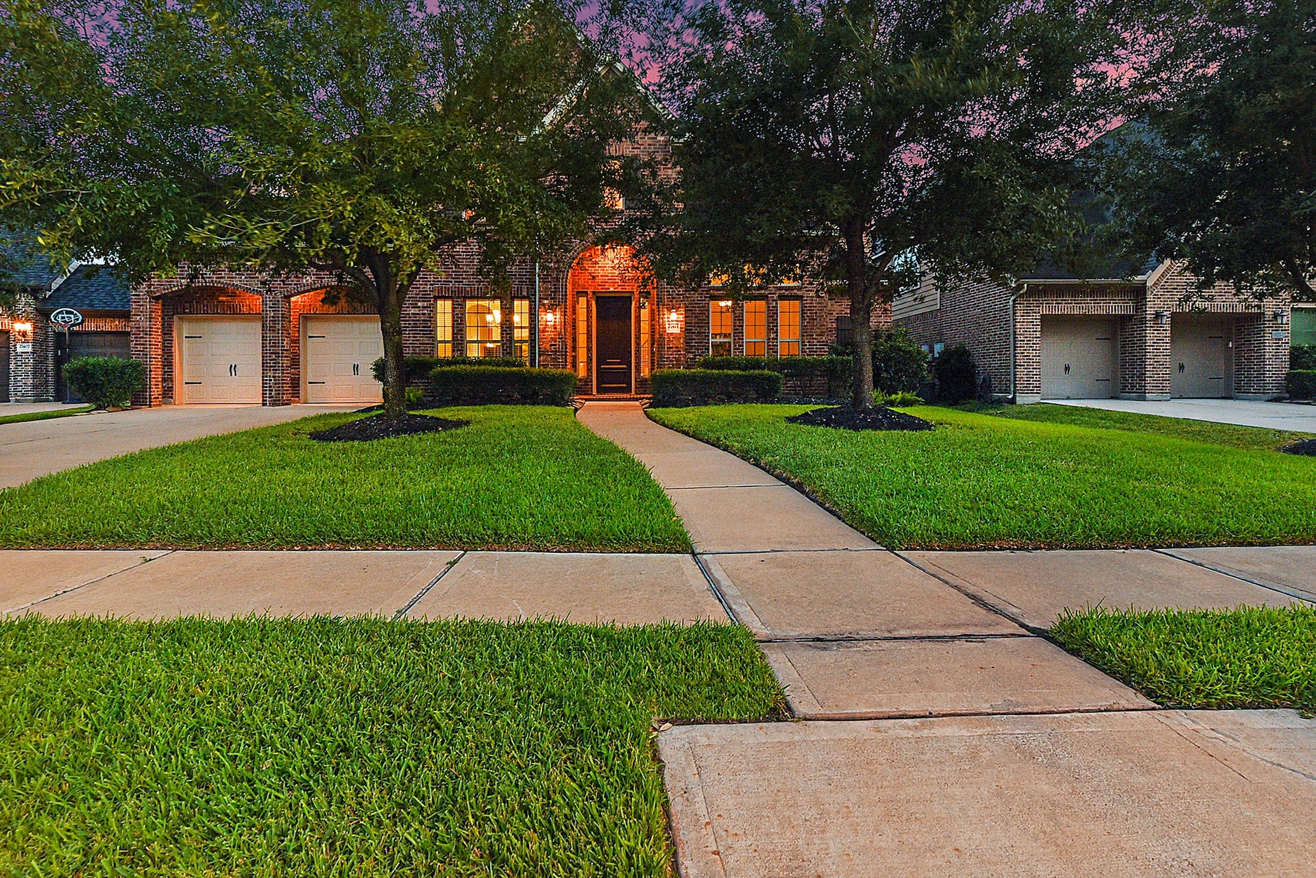 27411 Gladway Manor Drive, Katy, TX 77494 A welcoming walkway leads to the grand entrance, featuring an impressive covered front entry that creates a warm first impression. Professionally landscaped grounds enhance the curb appeal and complement this beautifully maintained, move-in-ready home.