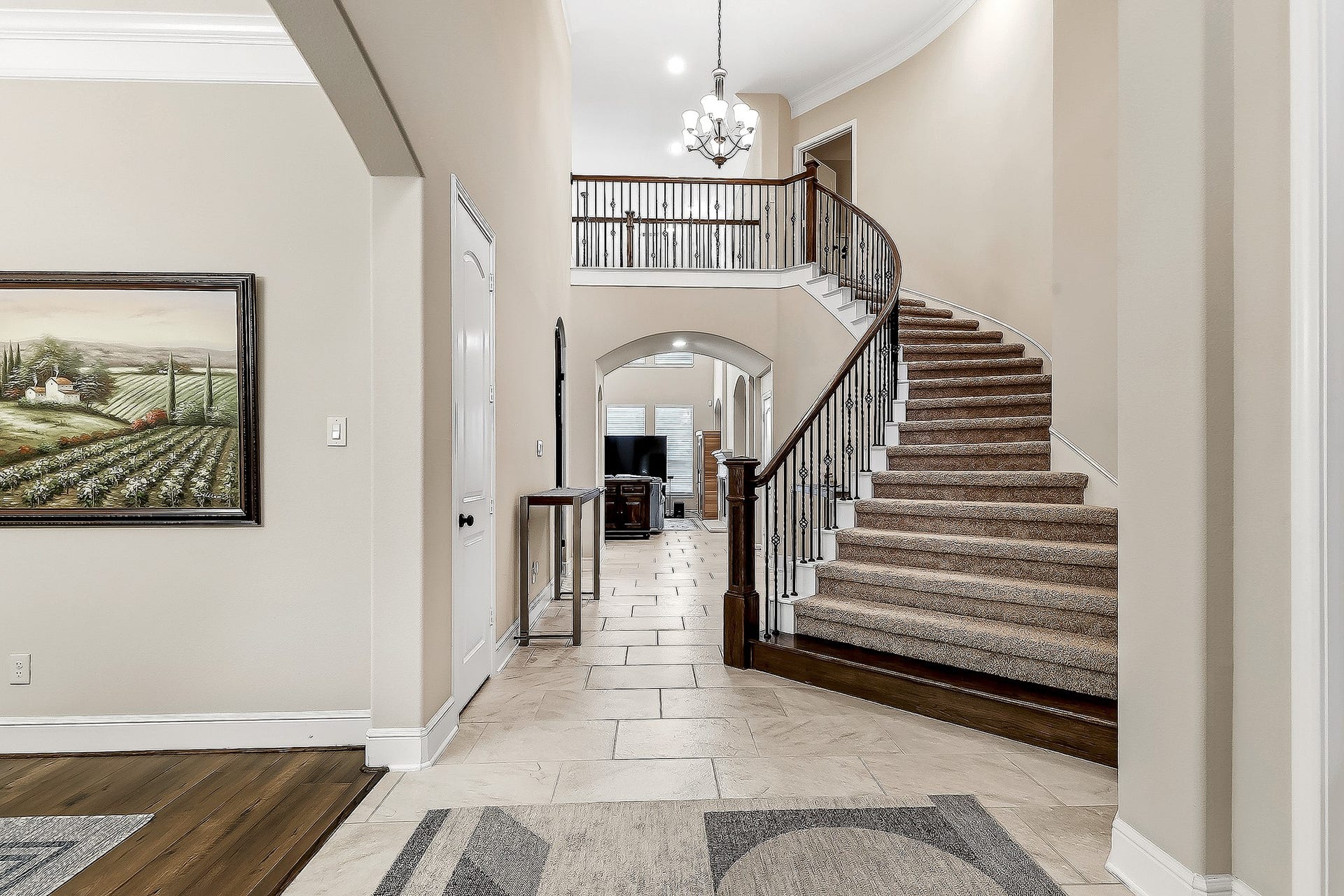 27411 Gladway Manor Drive, Katy, TX 77494 As you enter, youre greeted by an elegant staircase that sets the tone for the home. To the left, the formal dining room flows seamlessly into the island kitchen through the convenient butlers pantry, creating an ideal space for entertaining and meal preparation. To the right, French doors lead to a private home office, with both the office and entryway offering views of the front yard.