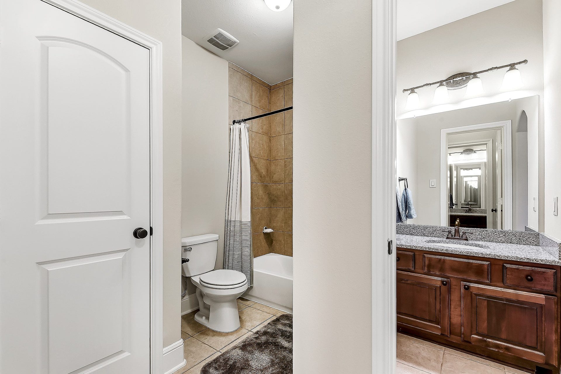 27411 Gladway Manor Drive, Katy, TX 77494 Another view showcases the spacious shared Hollywood-style bathroom and its thoughtful layout. Each of the two connected bedrooms has its own private vanity and sink within the bedroom, providing added privacy and convenience while allowing multiple people to get ready at the same time. The shared bathroom area offers a practical setup that works beautifully for family living and overnight guests.