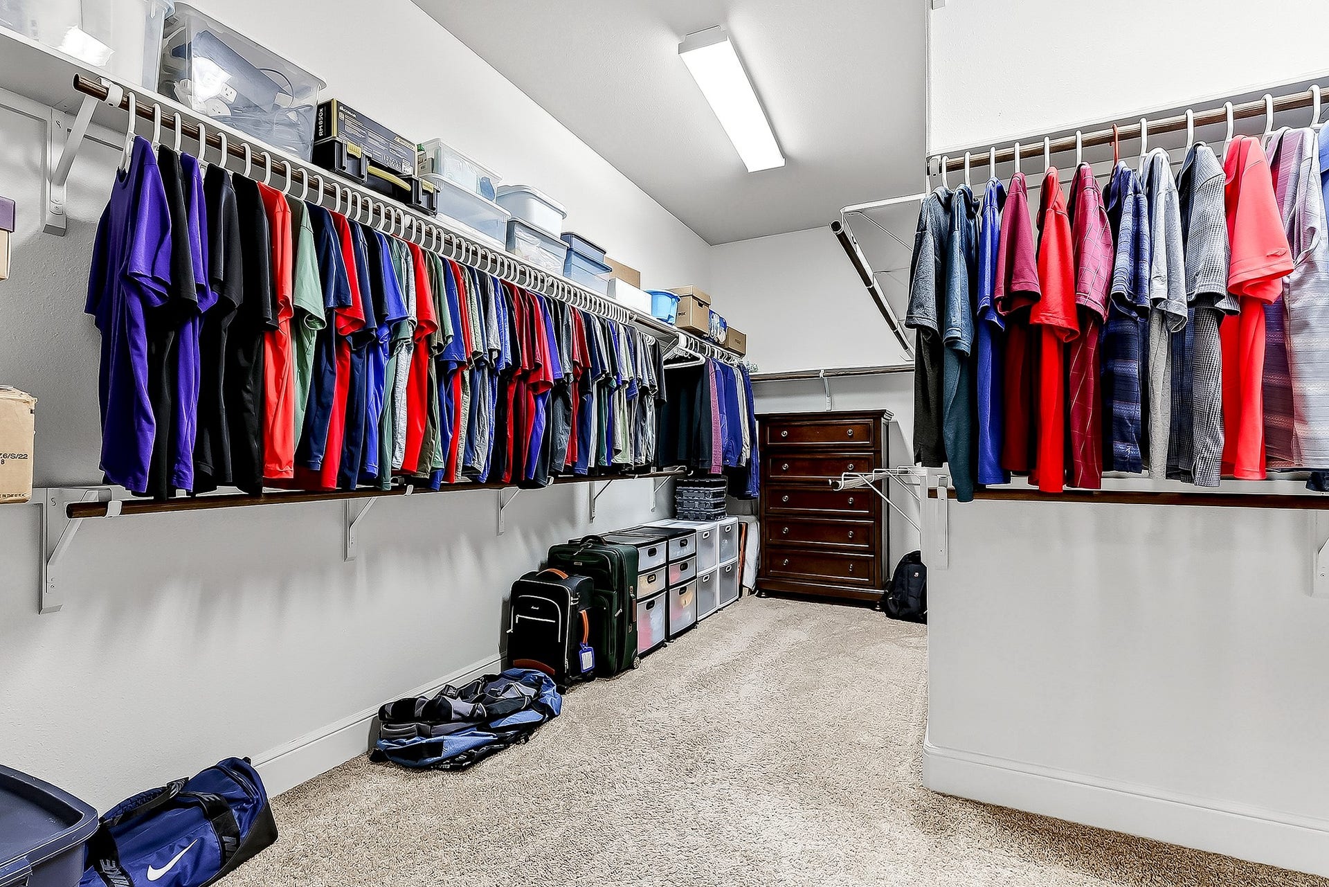 27411 Gladway Manor Drive, Katy, TX 77494 The oversized walk-in wardrobe closet offers exceptional storage with double-hanging racks, built-in shelving, and plenty of space to keep everything organized.