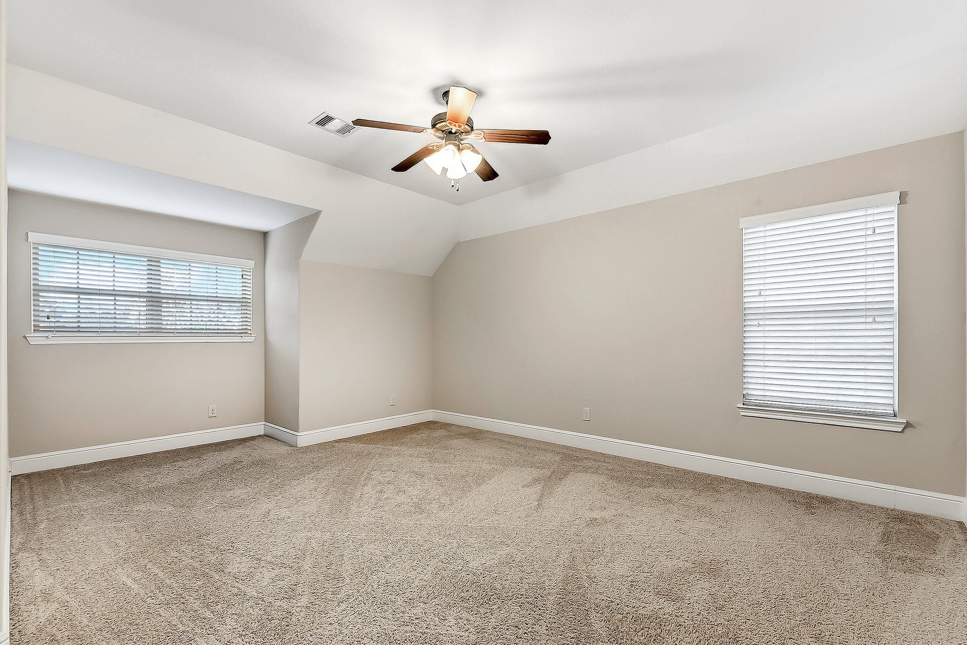 27411 Gladway Manor Drive, Katy, TX 77494 This huge guest bedroom offers plenty of space and flexibility, featuring two windows that fill the room with natural light and a ceiling fan for added comfort. The generous layout provides ample room for multiple occupants, a dedicated desk or study area, or a comfortable hobby space. The bedroom also features its own attached bathroom, adding convenience and privacy for family members or overnight guests.