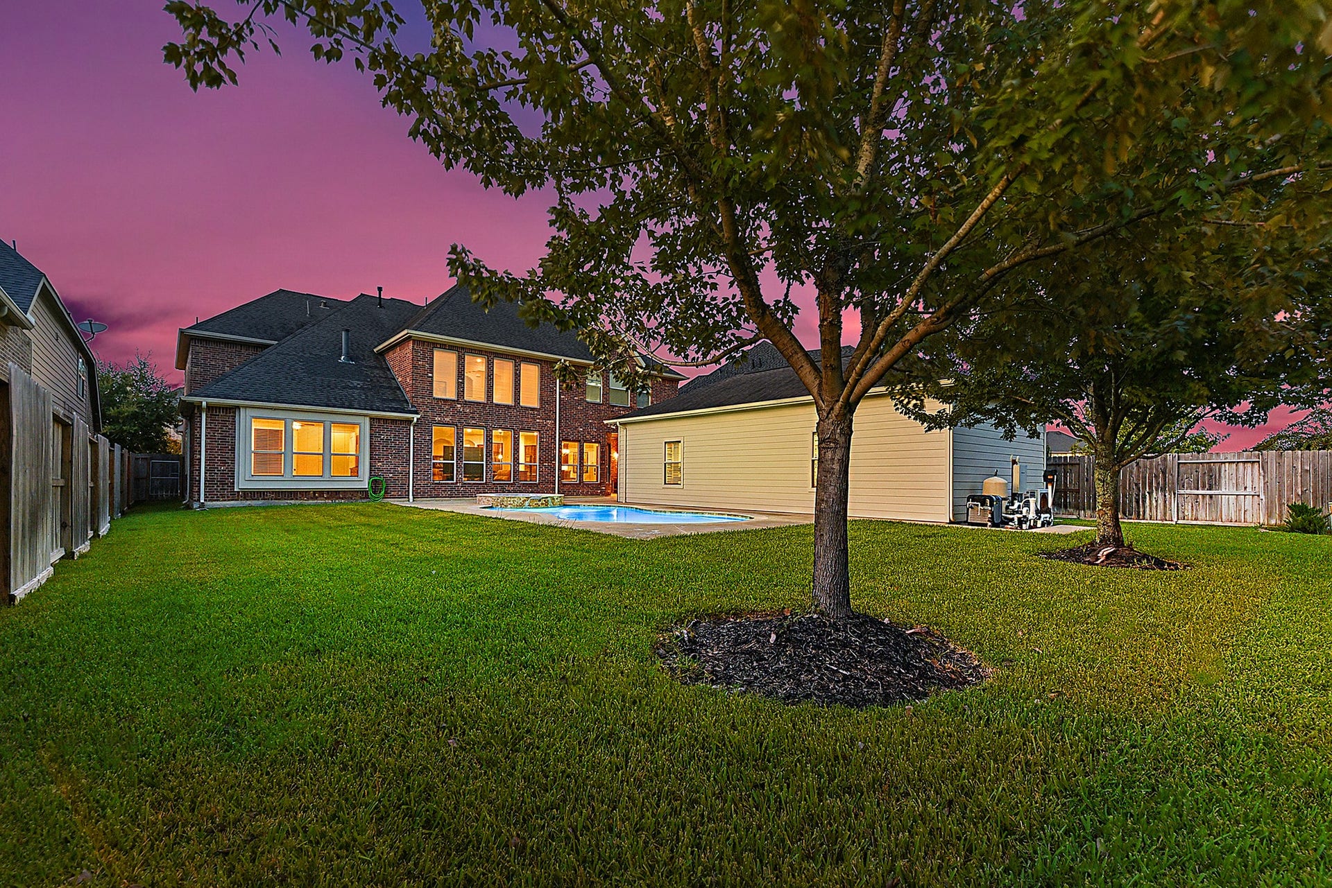 27411 Gladway Manor Drive, Katy, TX 77494 Stepping farther back, youll appreciate the generous backyard with plenty of additional green space and room to enjoy the outdoors. From this view, the windows to the left belong to the spacious primary bedroom. Two additional mature trees add beauty, shade, and character to the backyard.
