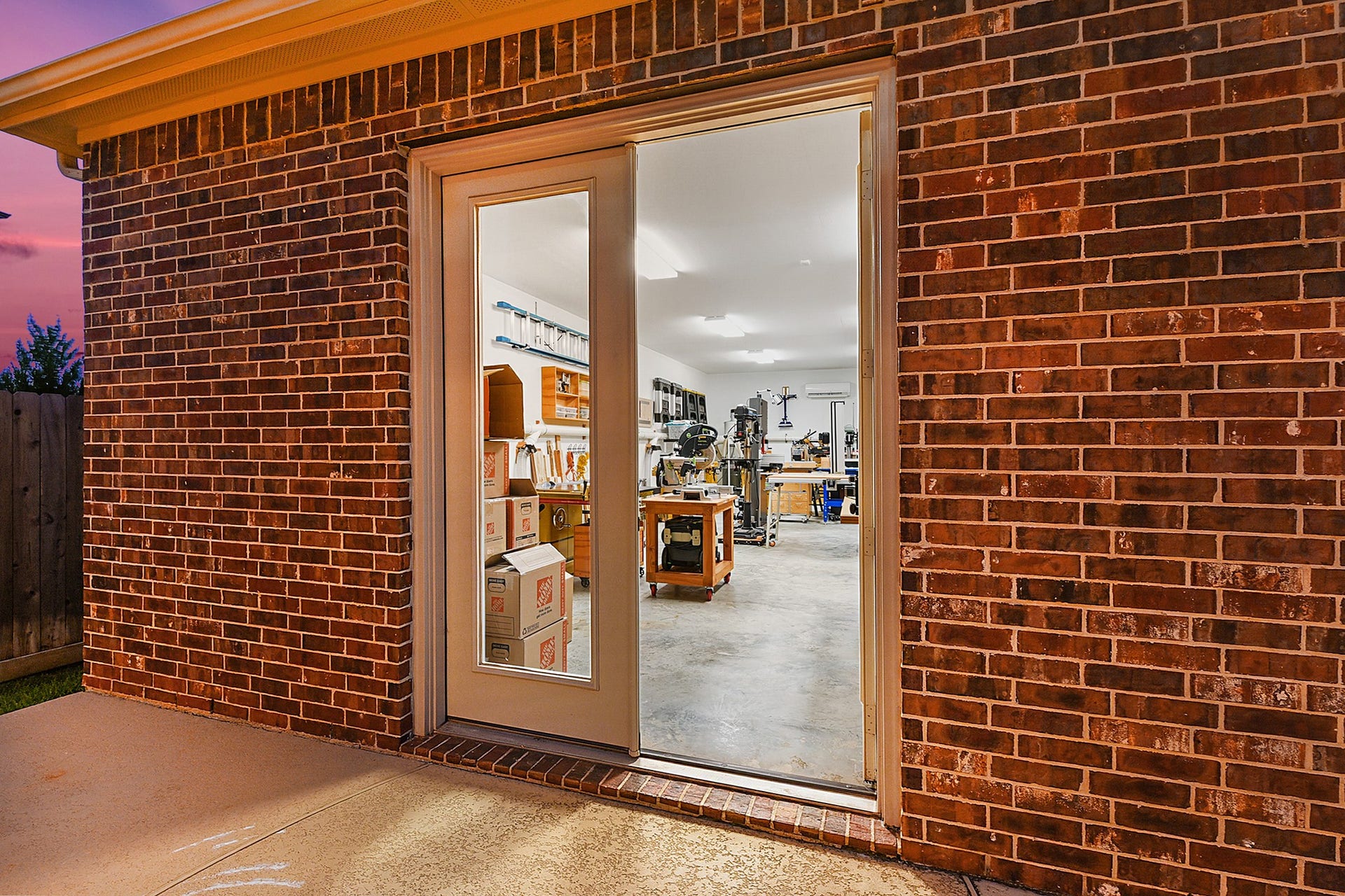 27411 Gladway Manor Drive, Katy, TX 77494 French doors lead into the approximately 800 sq. ft. detached workshop, providing a welcoming entry to this versatile and expansive space.