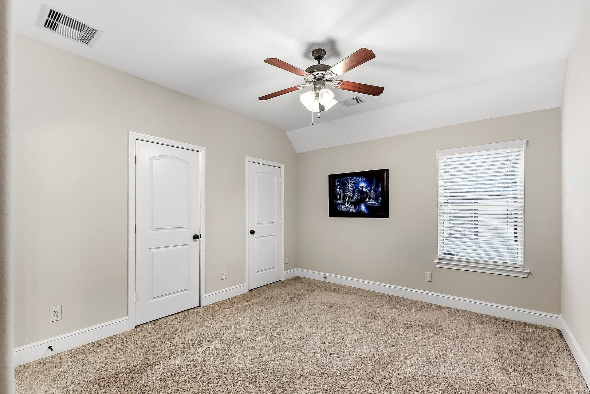 27411 Gladway Manor Drive, Katy, TX 77494 Upstairs, youll find three generously sized bedrooms, each offering spacious closets, ceiling fans, and coordinating window treatments. The bedrooms share a beautifully appointed Hollywood-style bathroom, featuring separate vanities with their own sinks for added convenience and functionality. The spacious layout provides easy access from each bedroom while maintaining a comfortable and private feel.
