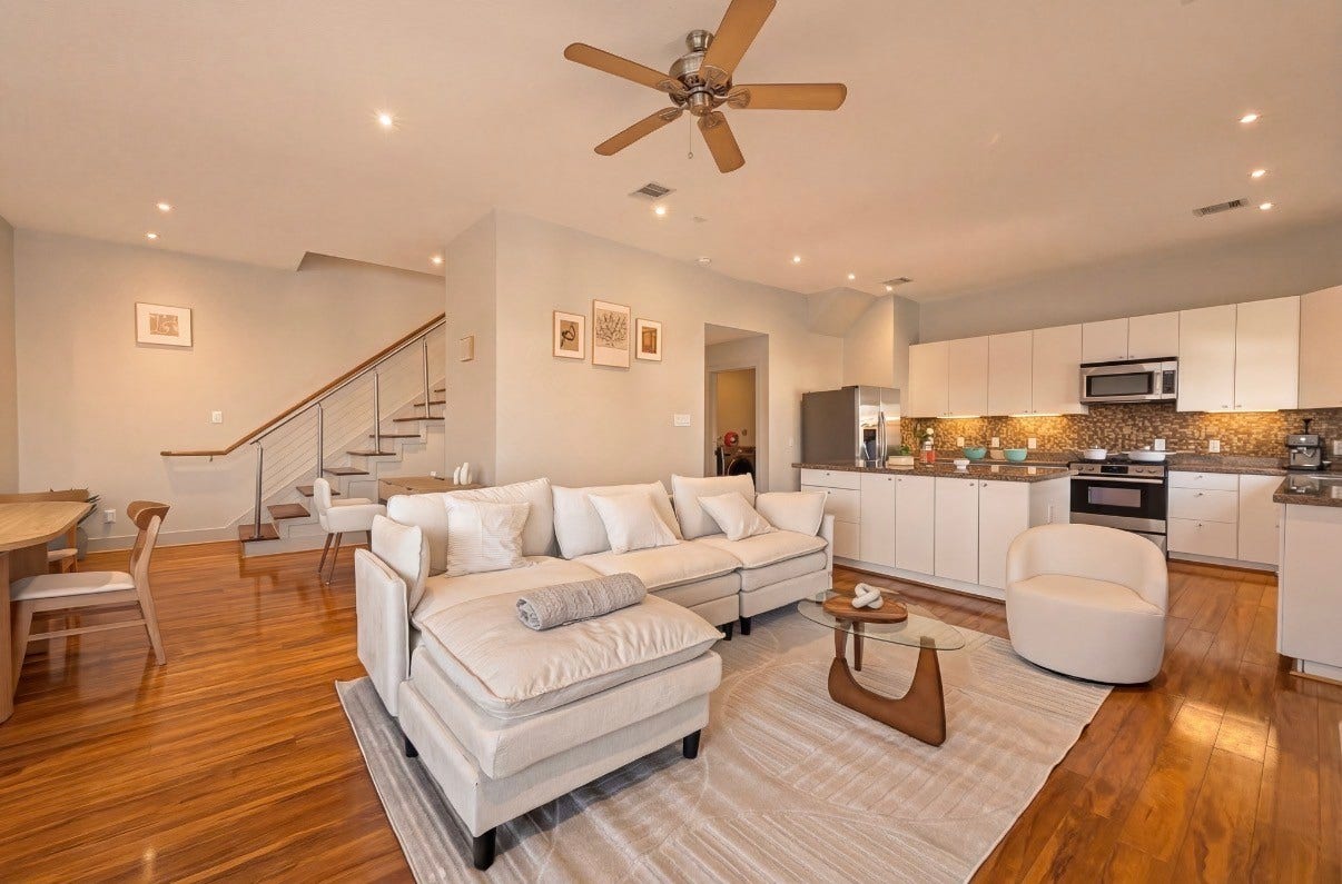 5111 Cornish Street, Houston, TX 77007 Spacious open-concept living area features sleek hardwood floors, a modern kitchen with stainless steel appliances, and a cozy seating area perfect for entertaining.