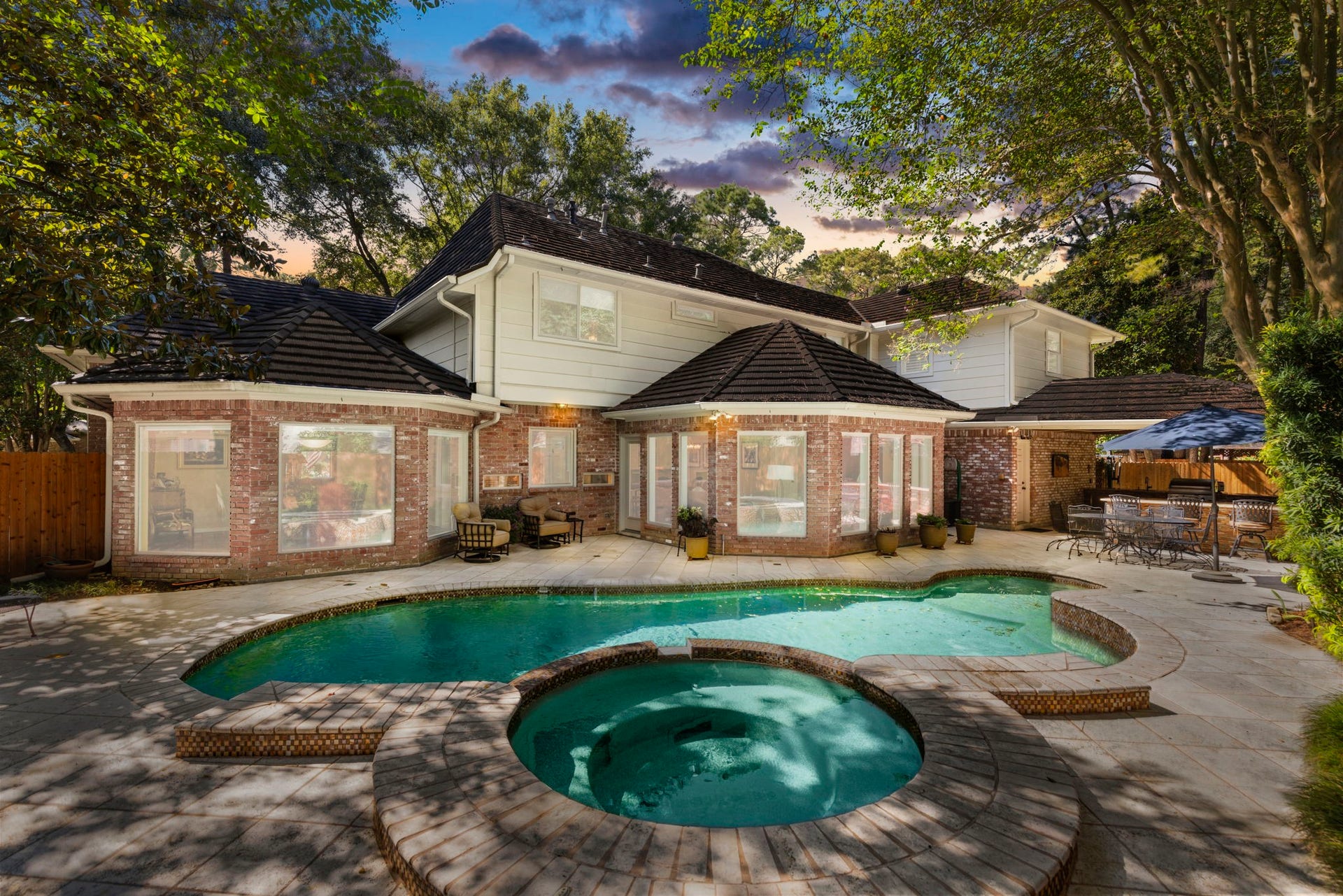 14018 Court Of Regents, Houston, TX 77069 From the spa to the covered outdoor kitchen, this backyard brings swimming, dining, and relaxation together, with an automatic mosquito repellent system adding convenience.