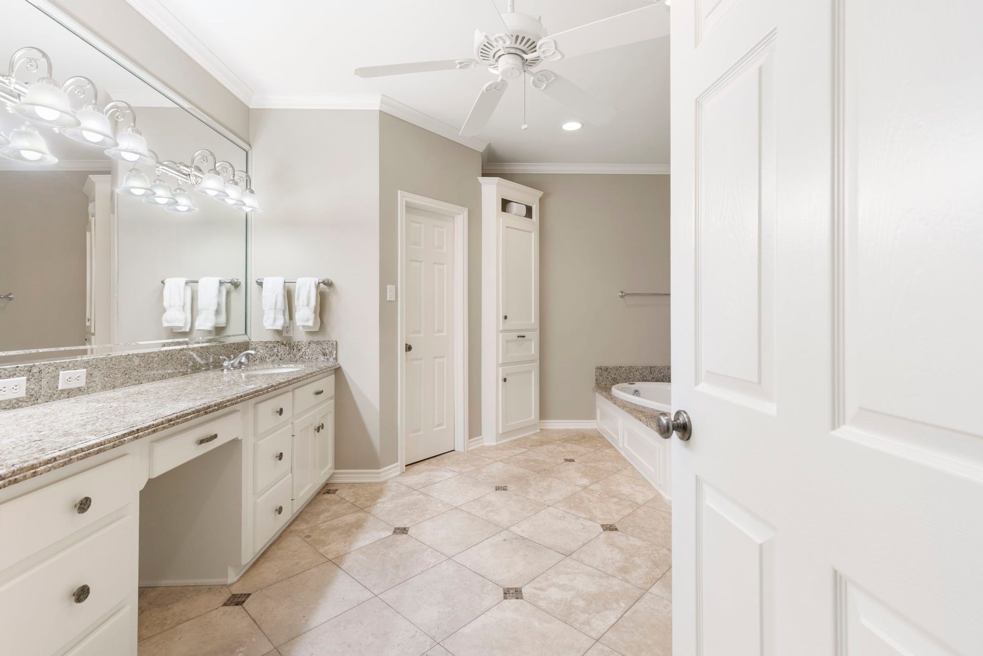 14018 Court Of Regents, Houston, TX 77069 A spacious primary bath pairs an extended vanity with a separate bathing area for a comfortable daily routine.