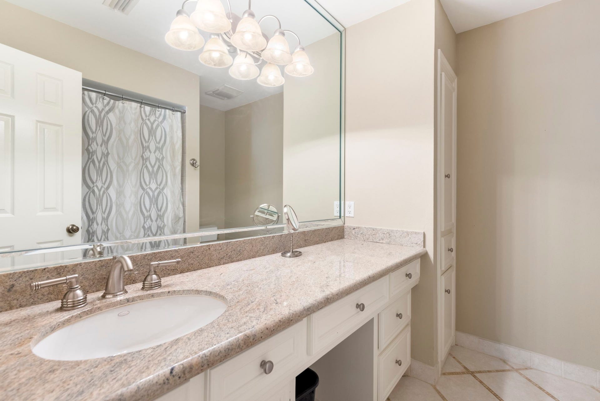 14018 Court Of Regents, Houston, TX 77069 An extended bathroom counter and abundant cabinetry provide useful storage and space for daily essentials.