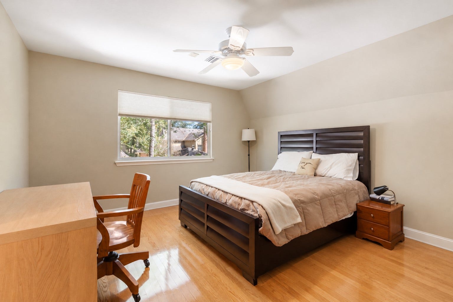 14018 Court Of Regents, Houston, TX 77069 Natural light, wood flooring, and comfortable proportions make this secondary bedroom an inviting personal retreat.