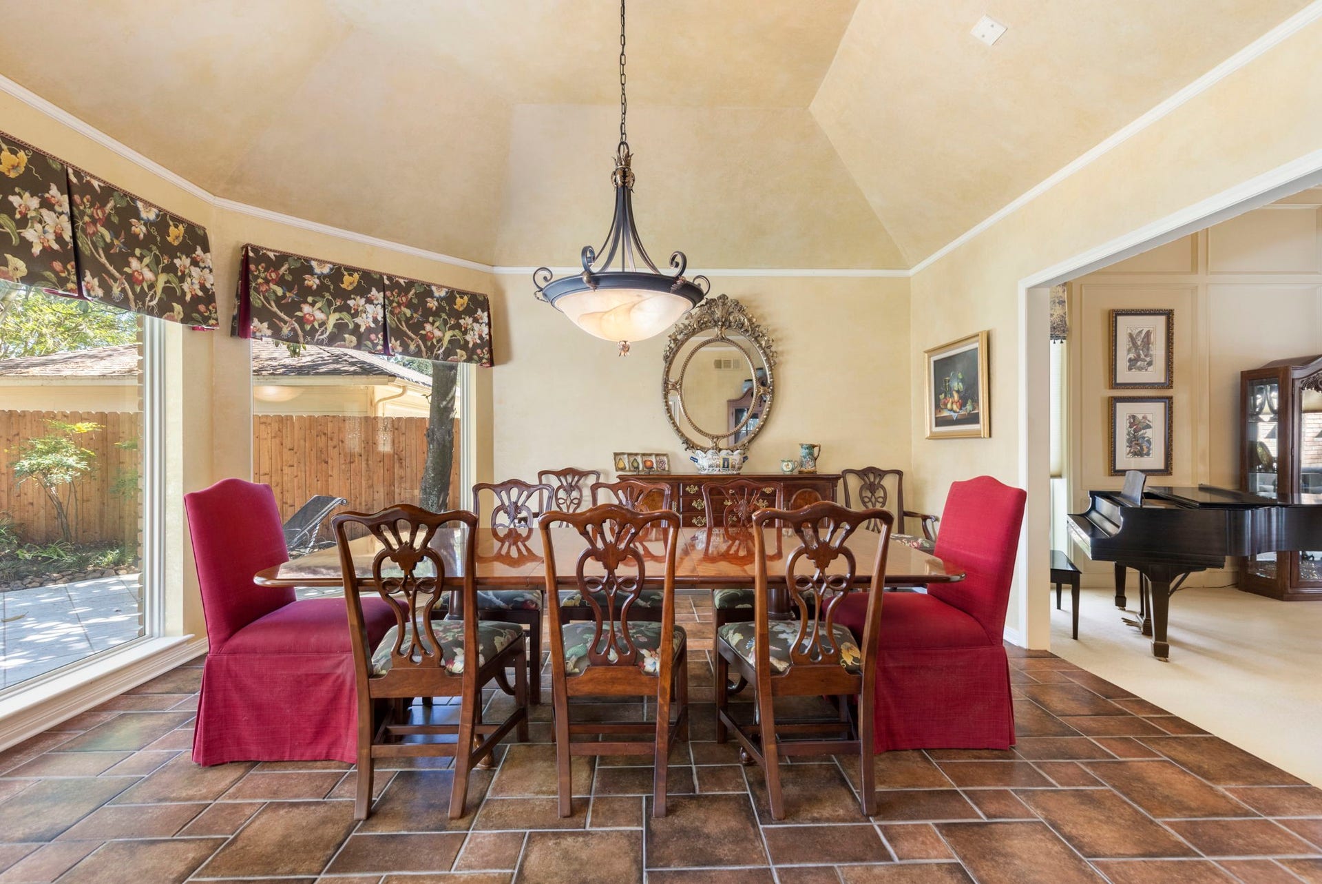 14018 Court Of Regents, Houston, TX 77069 Wrapped in backyard views, the intimate dining room offers a lovely setting for quiet dinners and special celebrations.