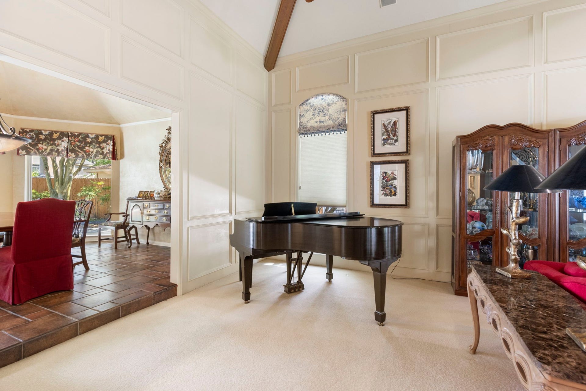14018 Court Of Regents, Houston, TX 77069 Generous openings connect the living and dining spaces while preserving the distinctive character of each room.