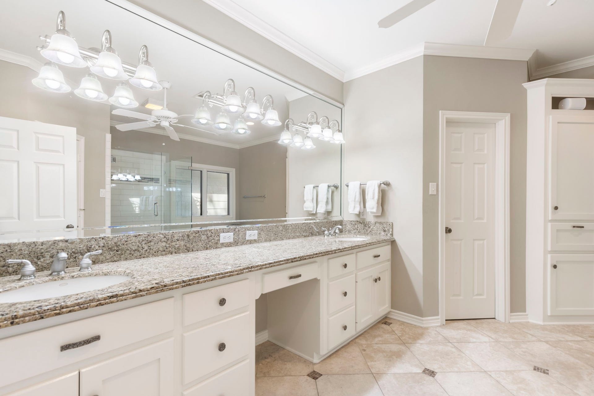 14018 Court Of Regents, Houston, TX 77069 Expansive counter space, abundant drawers, and a broad mirror make the primary vanity especially accommodating.