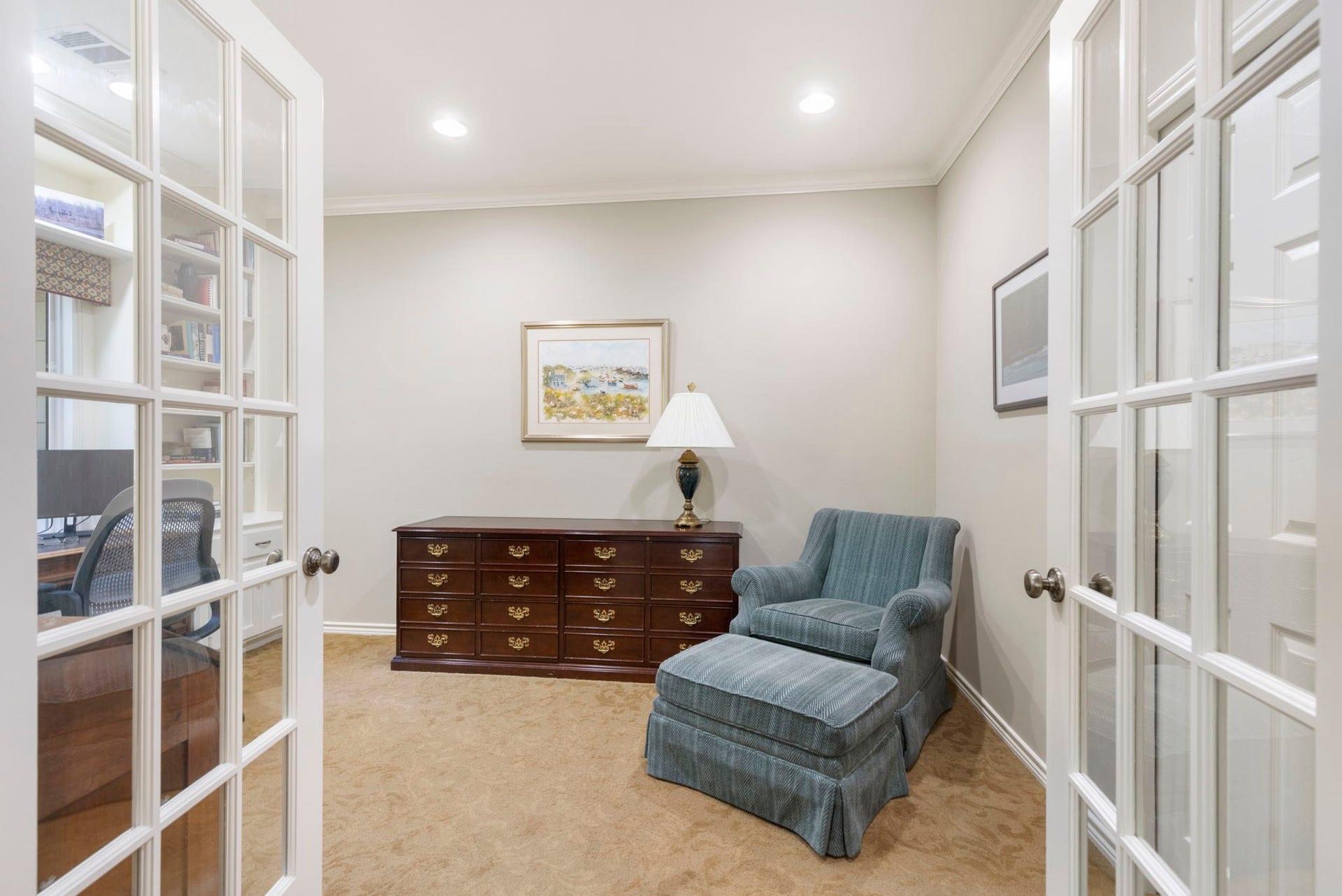14018 Court Of Regents, Houston, TX 77069 Glass French doors connect the primary bedroom with an adjoining private flex space suited to reading, work, or quiet retreat.