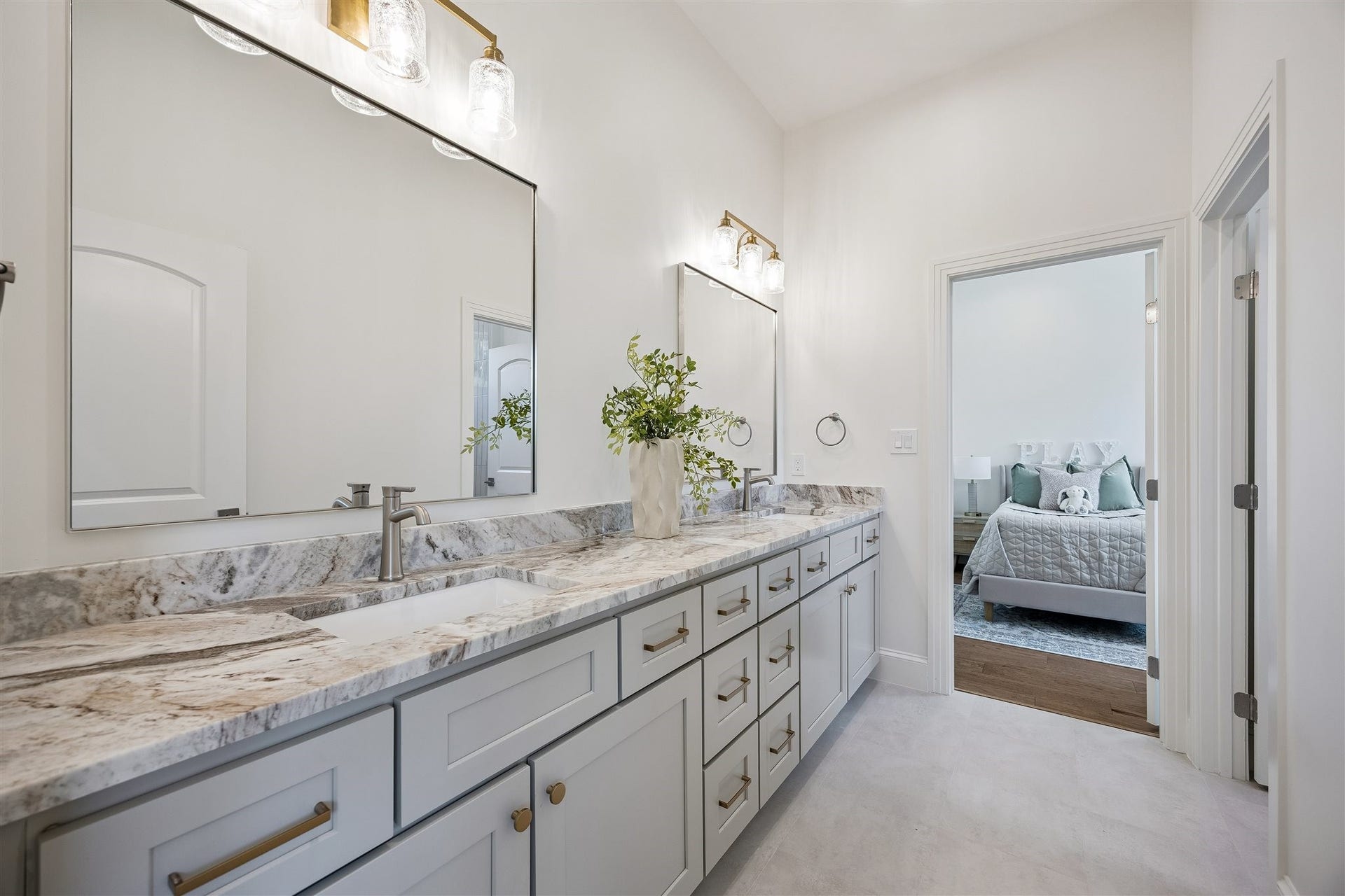 Jack-and-jill bathroom with double sinks between 3rd and 4th bedrooms