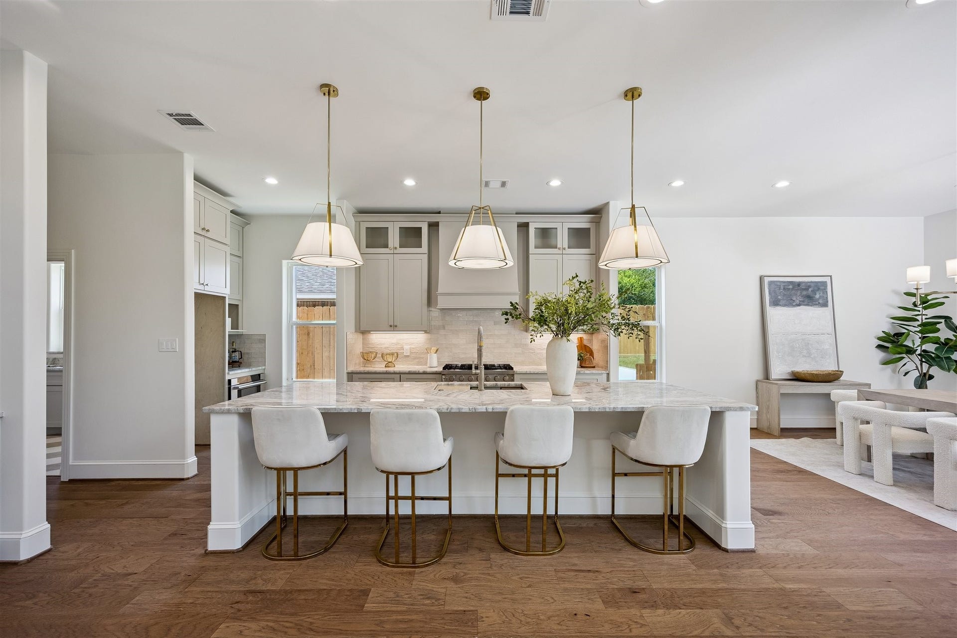 Gourmet kitchen with extra large 36" gas range, abundant storage, coffee bar, and breakast bar