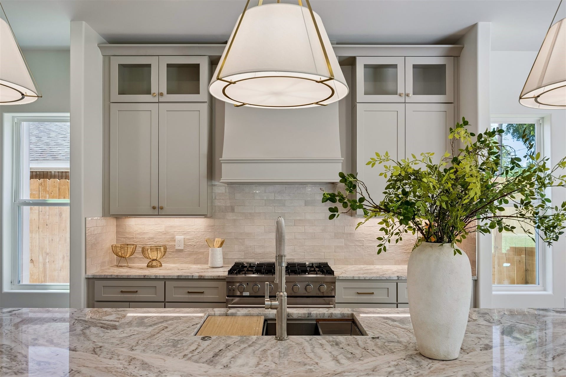 Gourmet kitchen with extra large 36" gas range, abundant storage, coffee bar, and breakast bar